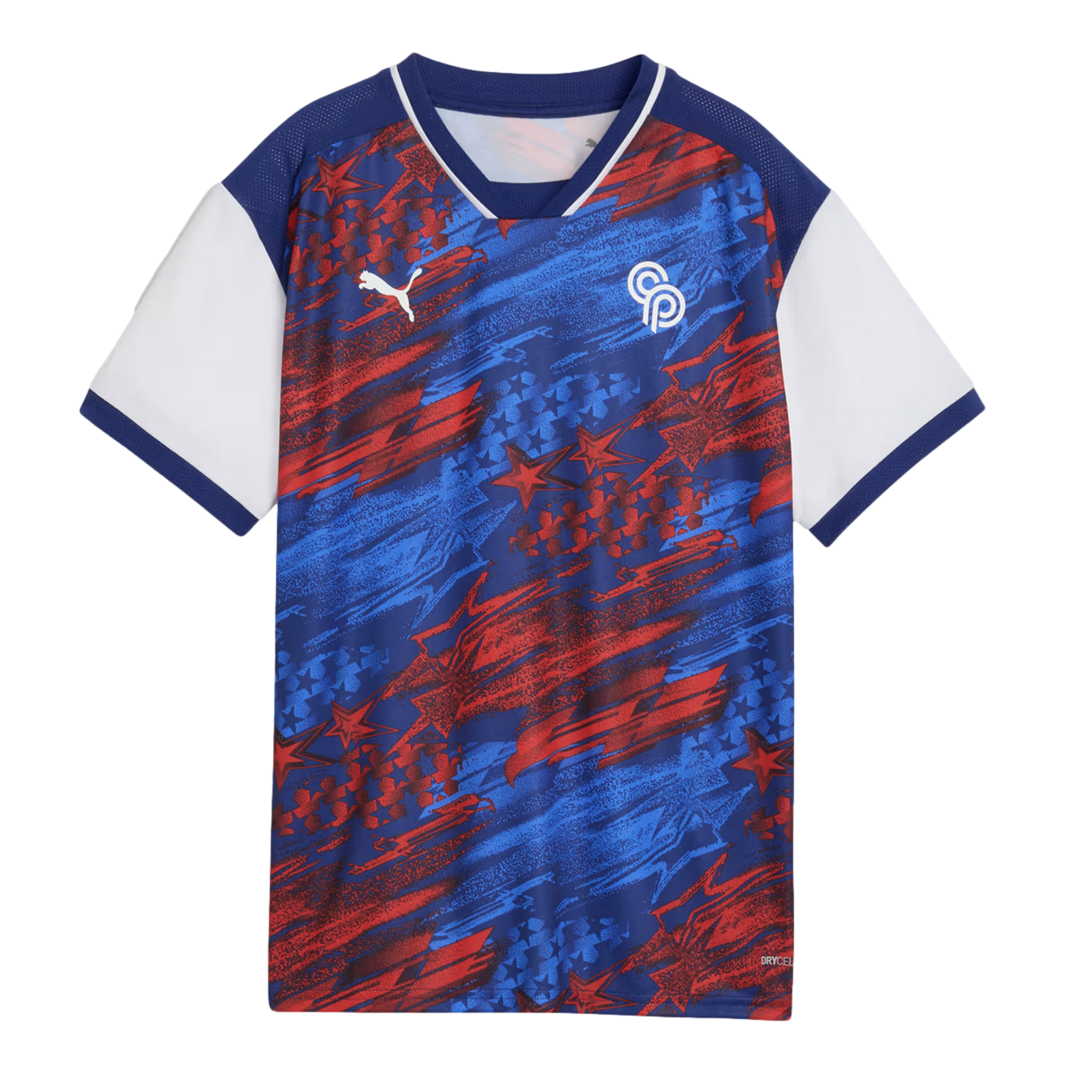 A short-sleeved Puma soccer jersey with a patriotic red, white, and blue theme. The main body of the shirt features an energetic, abstract pattern of blue and red brushstrokes and stars on a navy background. The jersey has a navy blue V-neck collar with w