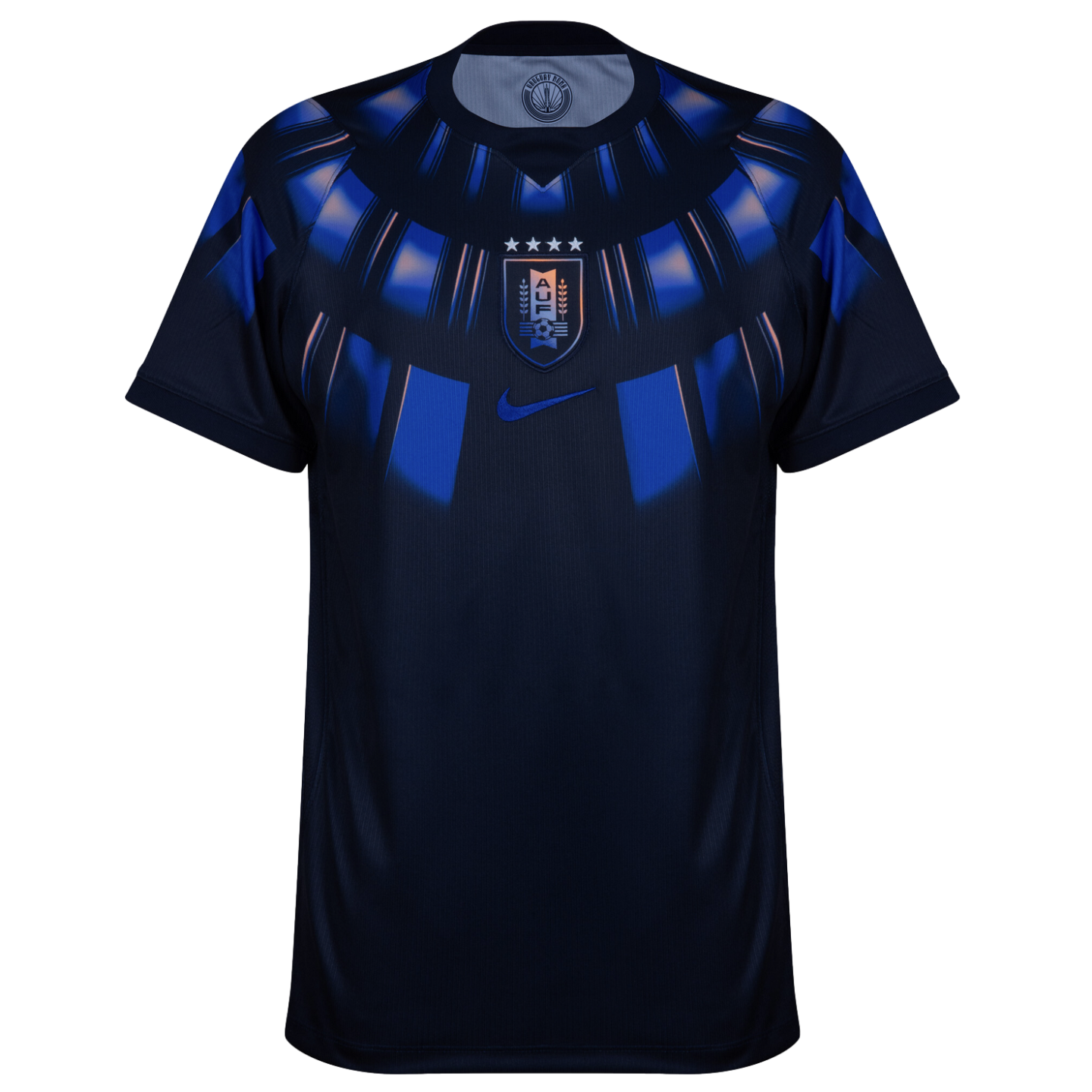 A front view of a navy blue Uruguay national team soccer jersey by Nike against a black background. The jersey features a blue and light blue radial graphic pattern around the neckline and upper chest. The Uruguay (AUF) team crest with four stars is cente