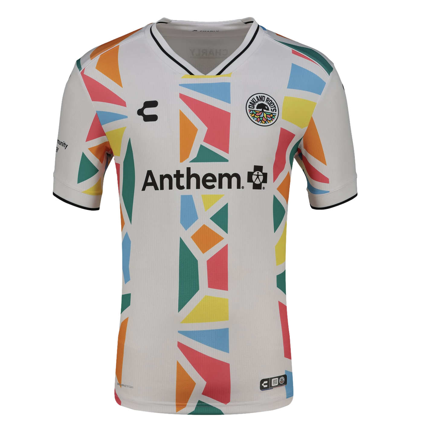 A white Oakland Roots soccer jersey featuring a colorful geometric mosaic pattern in orange, blue, pink, yellow, and green running vertically down the center and along the sides. The jersey includes the "Anthem" sponsor logo across the chest, the team cre