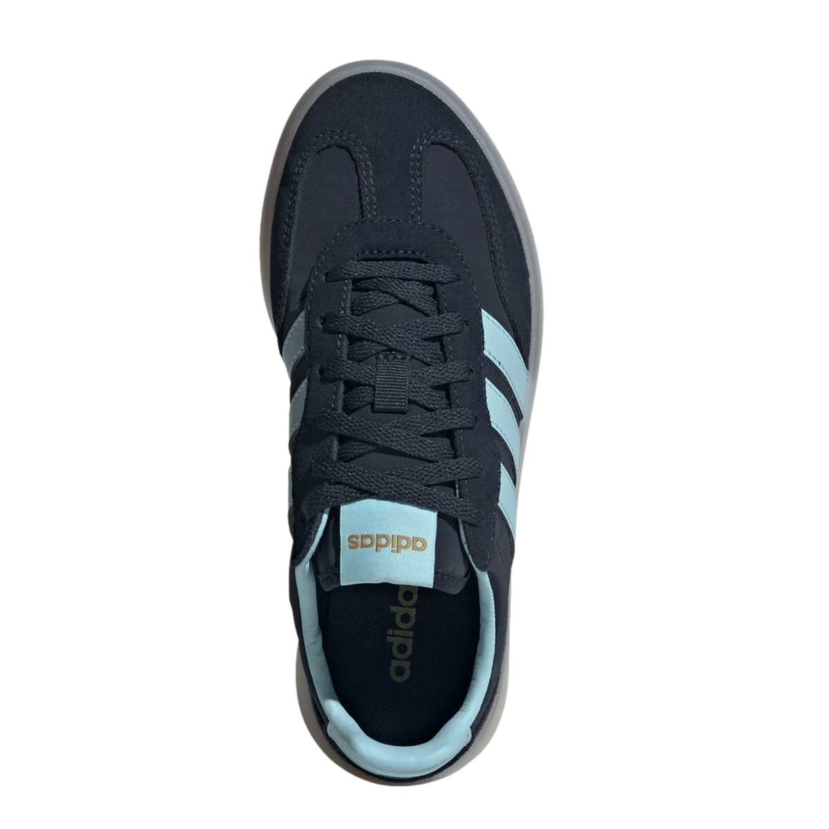 An overhead view of a navy blue Adidas sneaker with light blue stripes, tongue tag, and inner lining. The shoe features navy laces and a translucent grey sole, set against a solid black background.