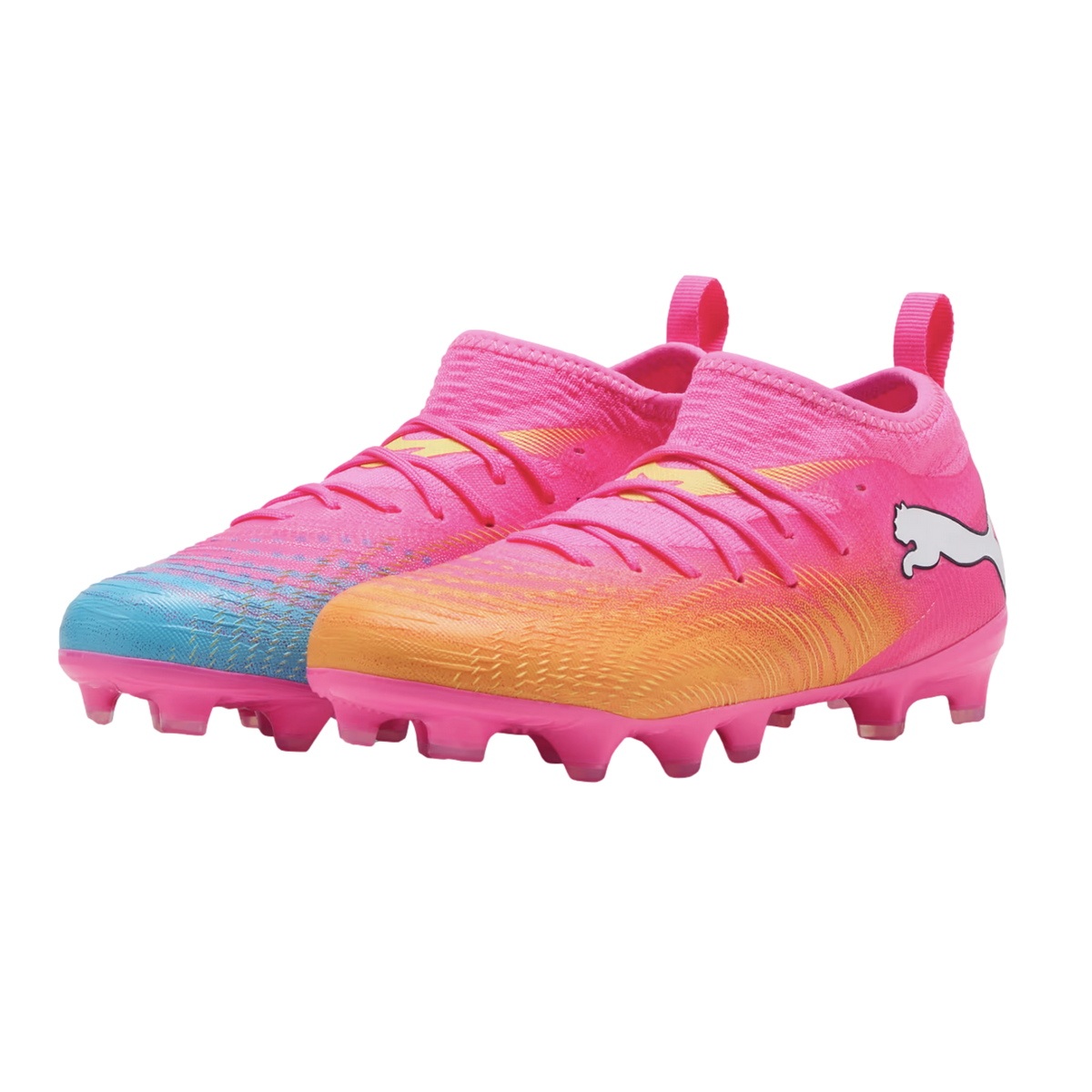 A pair of bright pink Puma soccer cleats with blue and orange gradients, pink studs, and white logos, isolated on a white background.