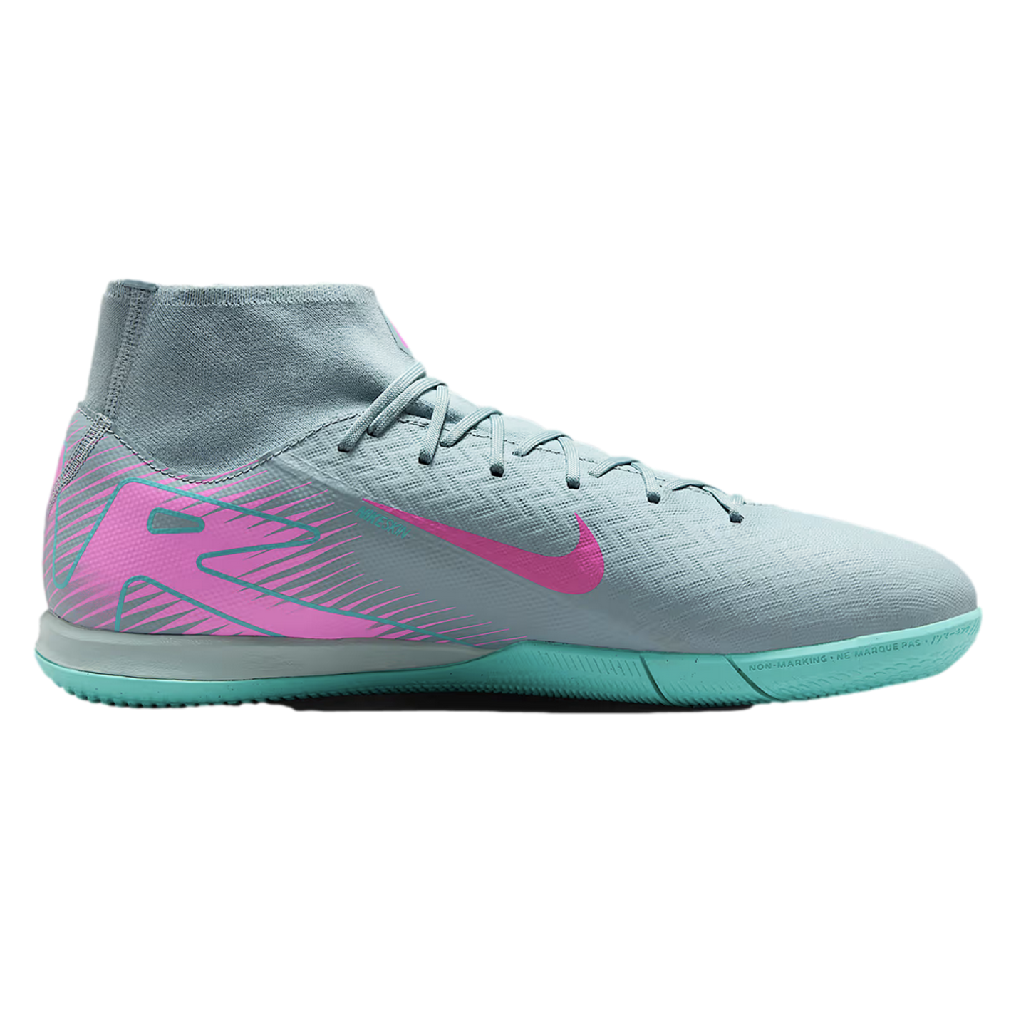 Grey Nike indoor soccer shoe with a pink swoosh and heel graphic, featuring a high-top sock-like collar and a turquoise flat rubber sole.