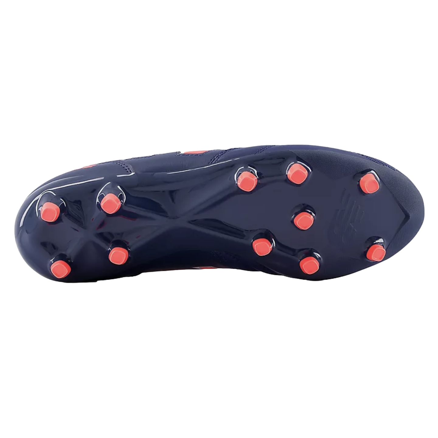 Bottom view of a navy blue New Balance soccer cleat, showing its soleplate with bright orange circular studs.