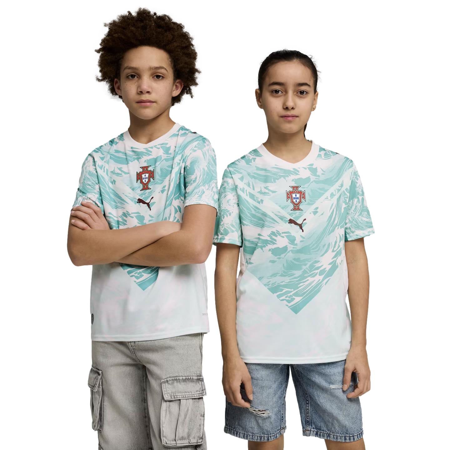 A boy and a girl stand side-by-side against a black background, wearing matching sports jerseys. The jerseys are white with a teal wave-like pattern on the upper half, featuring a team crest and a Puma logo in the center. The boy on the left has curly hai
