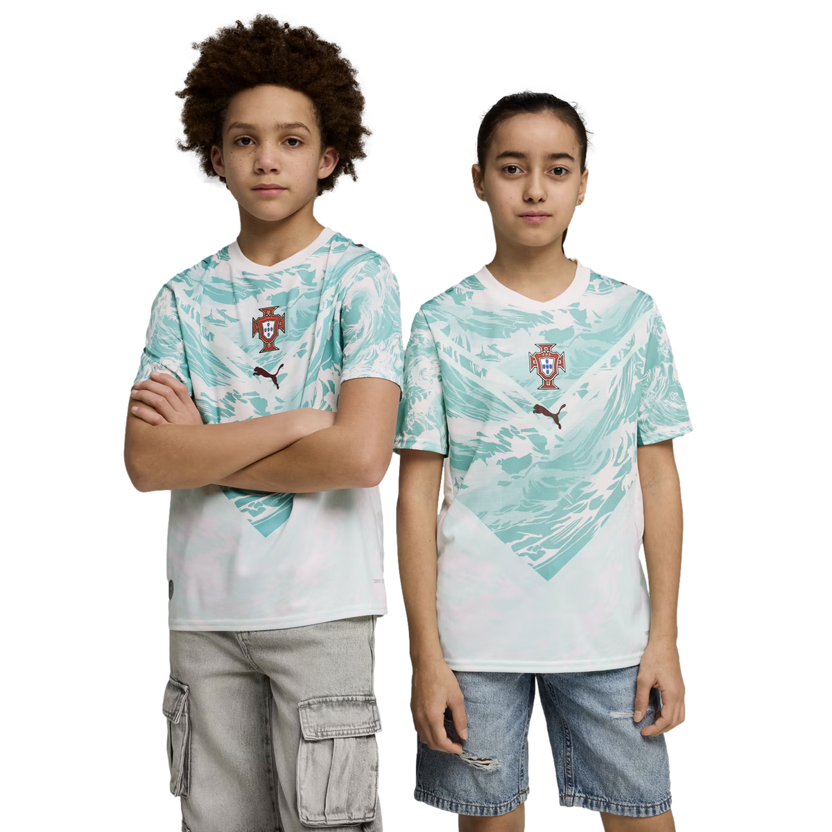 A boy and a girl stand side-by-side against a black background, wearing matching sports jerseys. The jerseys are white with a teal wave-like pattern on the upper half, featuring a team crest and a Puma logo in the center. The boy on the left has curly hai