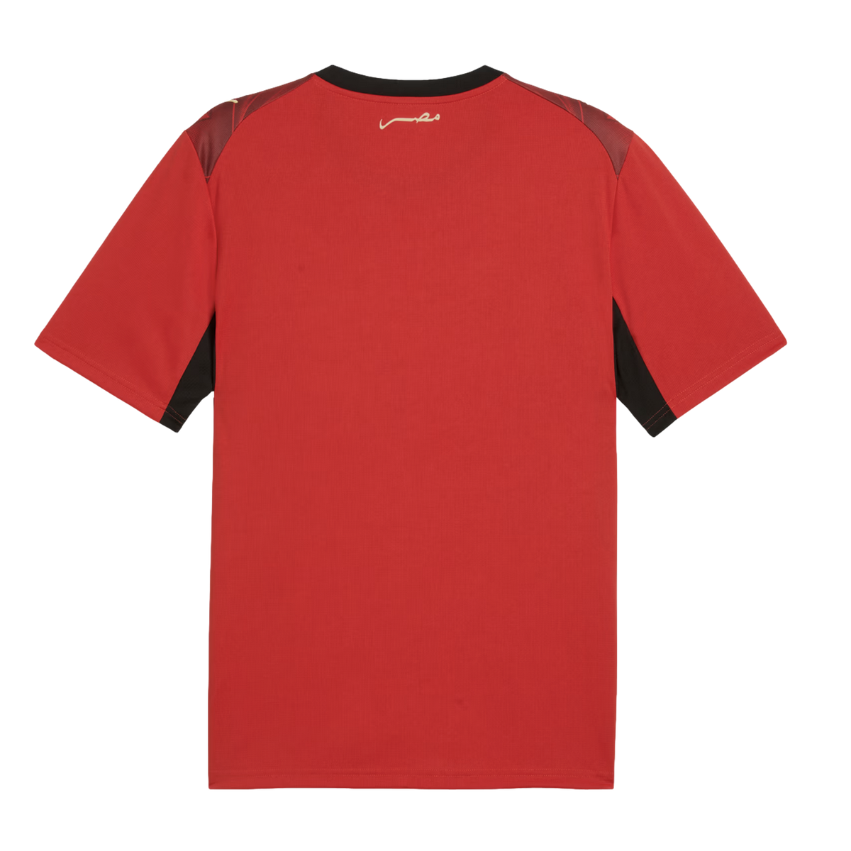 The back view of a red short-sleeved athletic jersey featuring a black collar, maroon shoulder panels, and black accents under the sleeves. A small, white Arabic script logo is centered below the back of the neck.