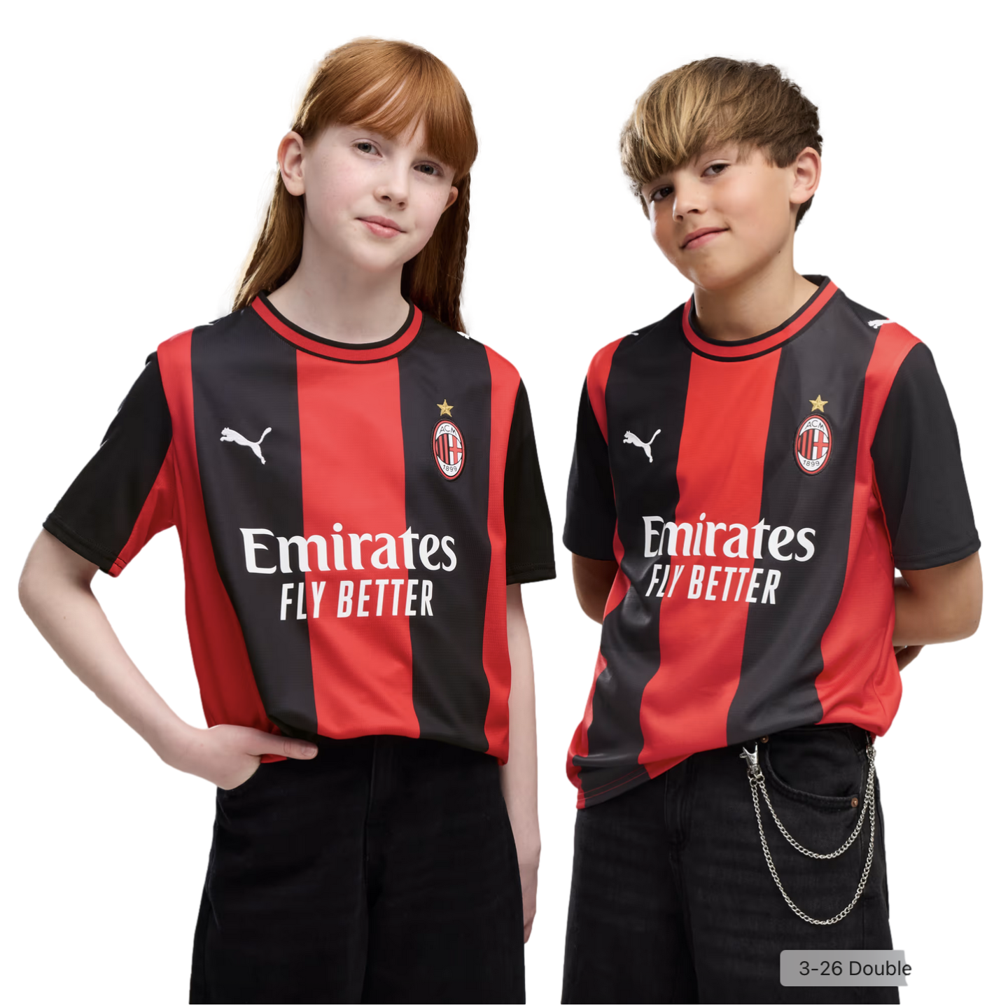 A red-haired girl and a blonde boy pose side-by-side in matching red and black AC Milan football jerseys against a plain white background.