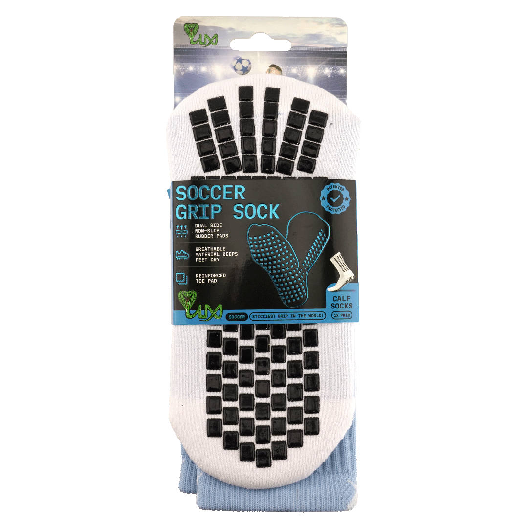 A package of white LUX soccer grip socks with black rectangular non-slip rubber pads on the sole and light blue calf material, shown against a white background.