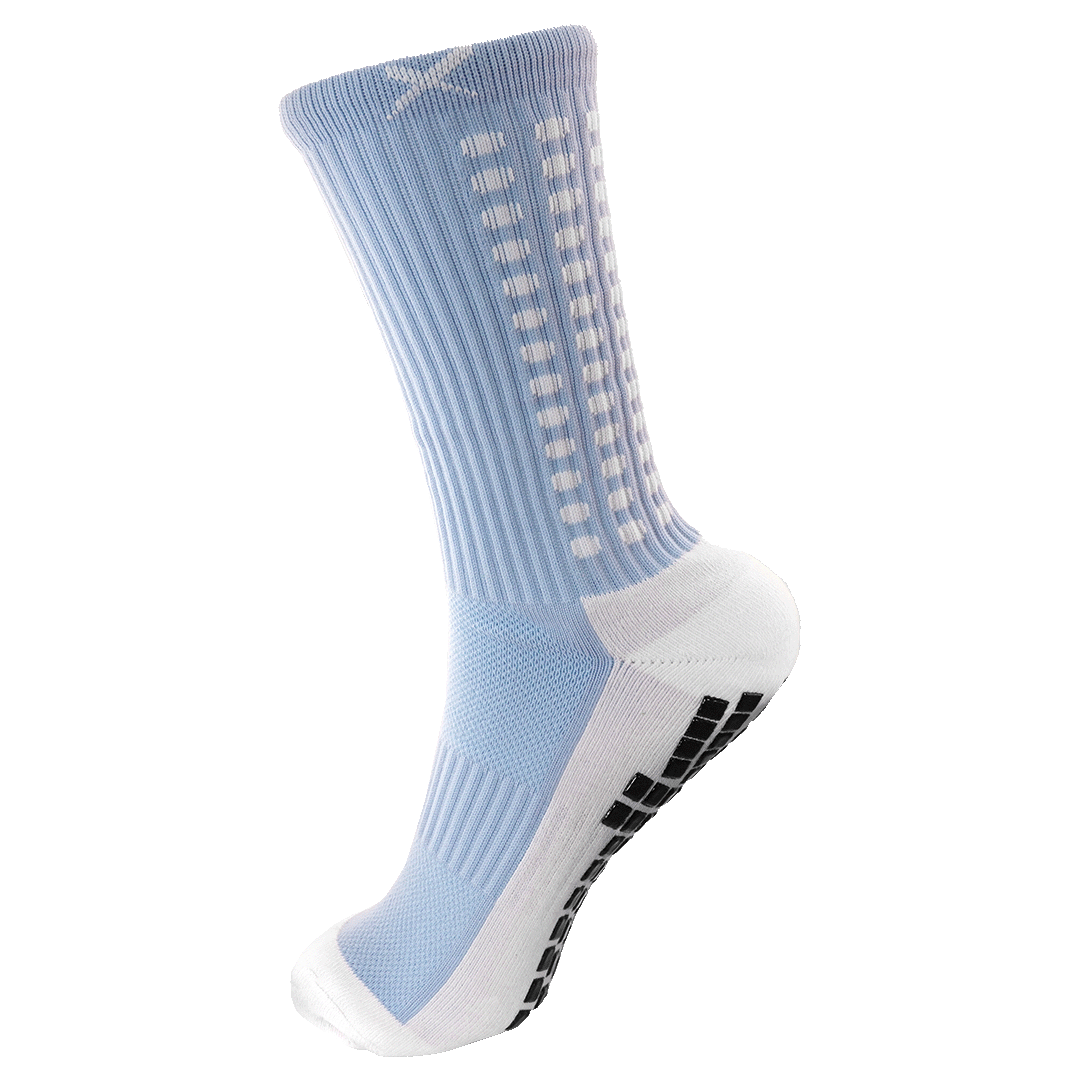 Light blue and white crew-length athletic sock with black non-slip grip pads on the sole and white rectangular details along the side.
