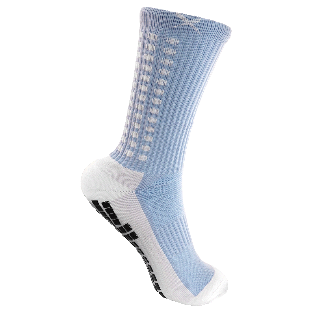 Light blue and white crew sock featuring black non-slip grip pads on the sole and vertical white dotted stripes.