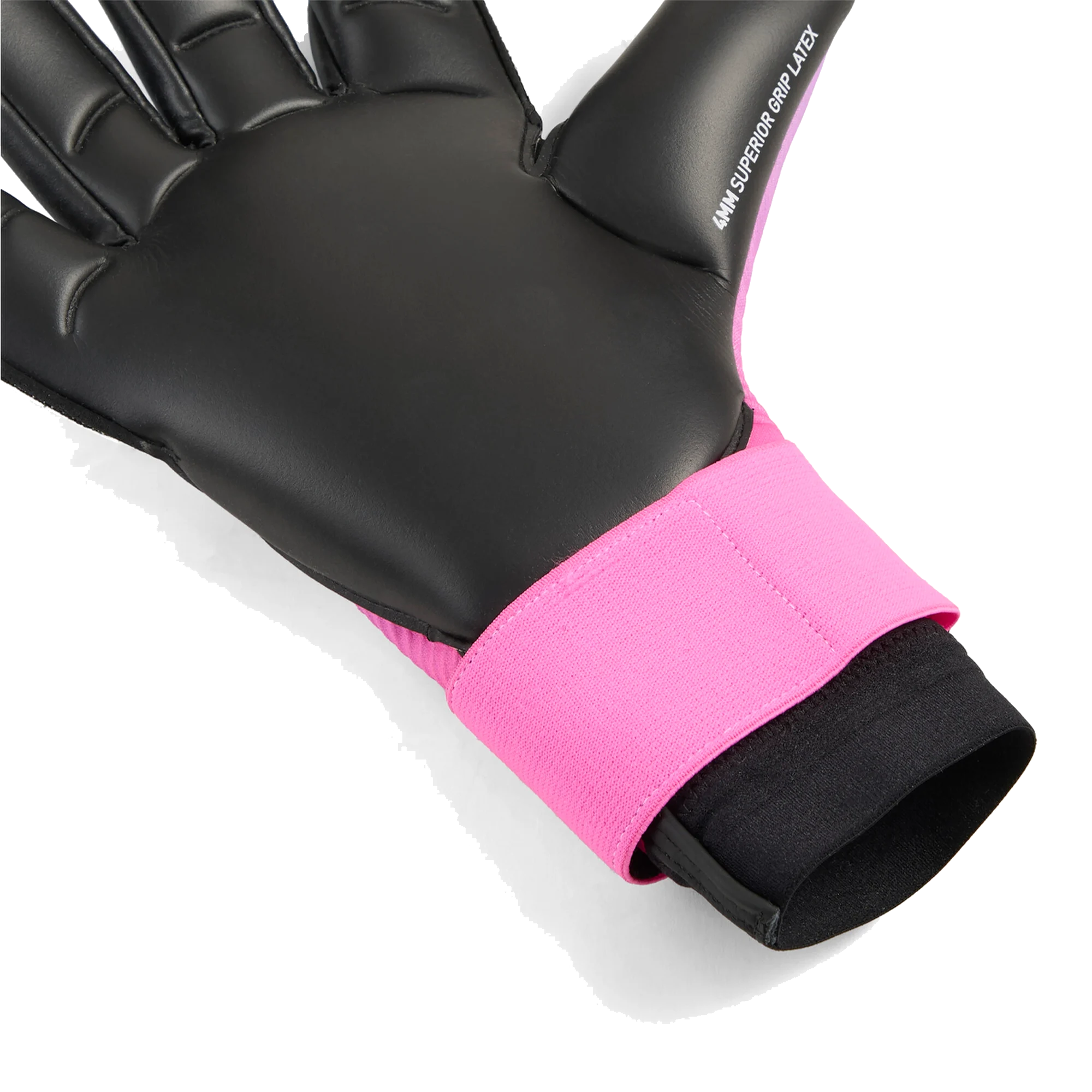 Close-up of a goalkeeper glove featuring a black latex palm and a bright pink wrist strap. The thumb is labeled "4MM SUPERIOR GRIP LATEX."