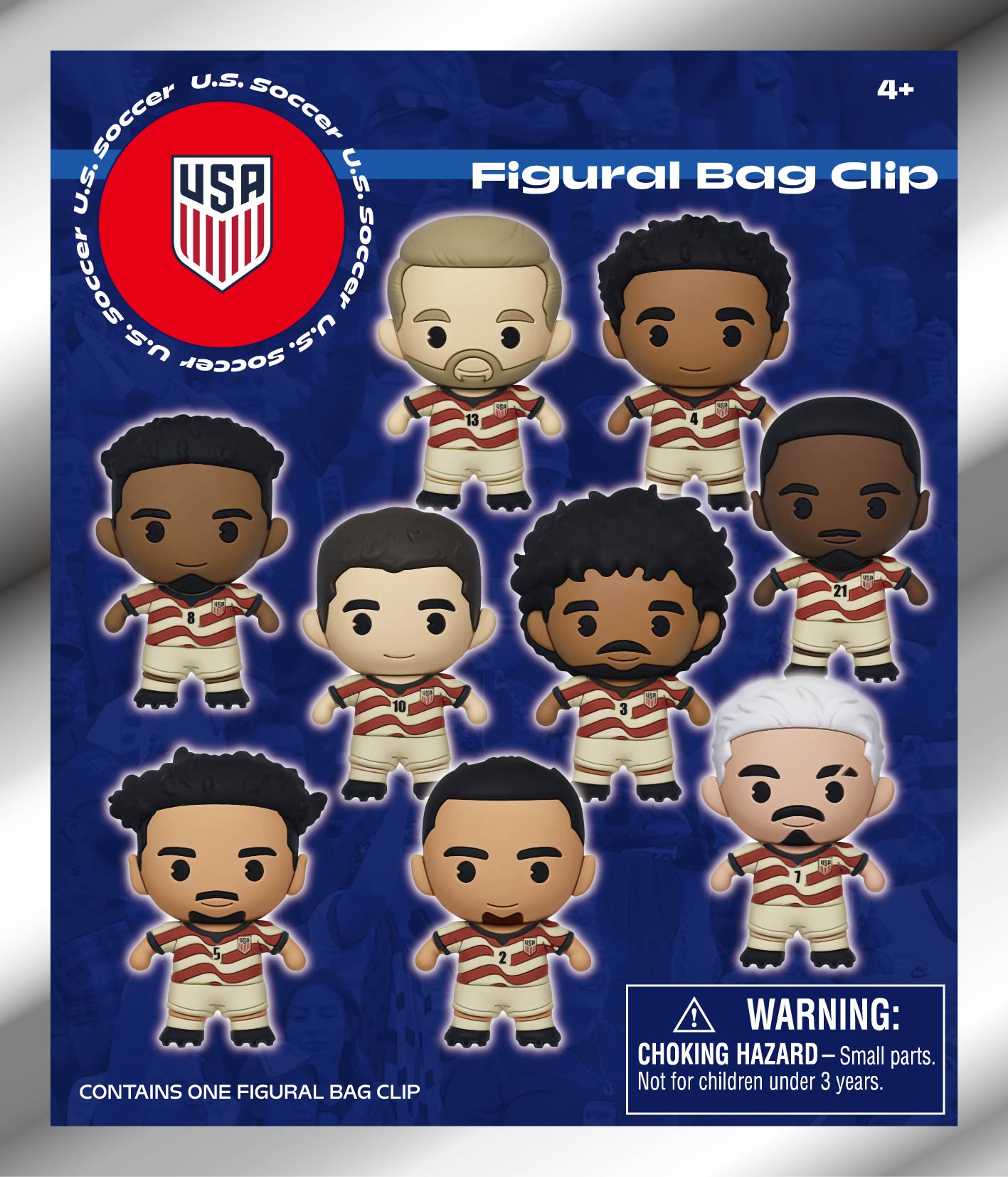 A promotional image for U.S. Soccer Figural Bag Clips features nine cartoonish, stylized player figurines on a blue background. The figures wear red and white striped jerseys with various numbers and the team's logo. The U.S. Soccer crest is in a red circ
