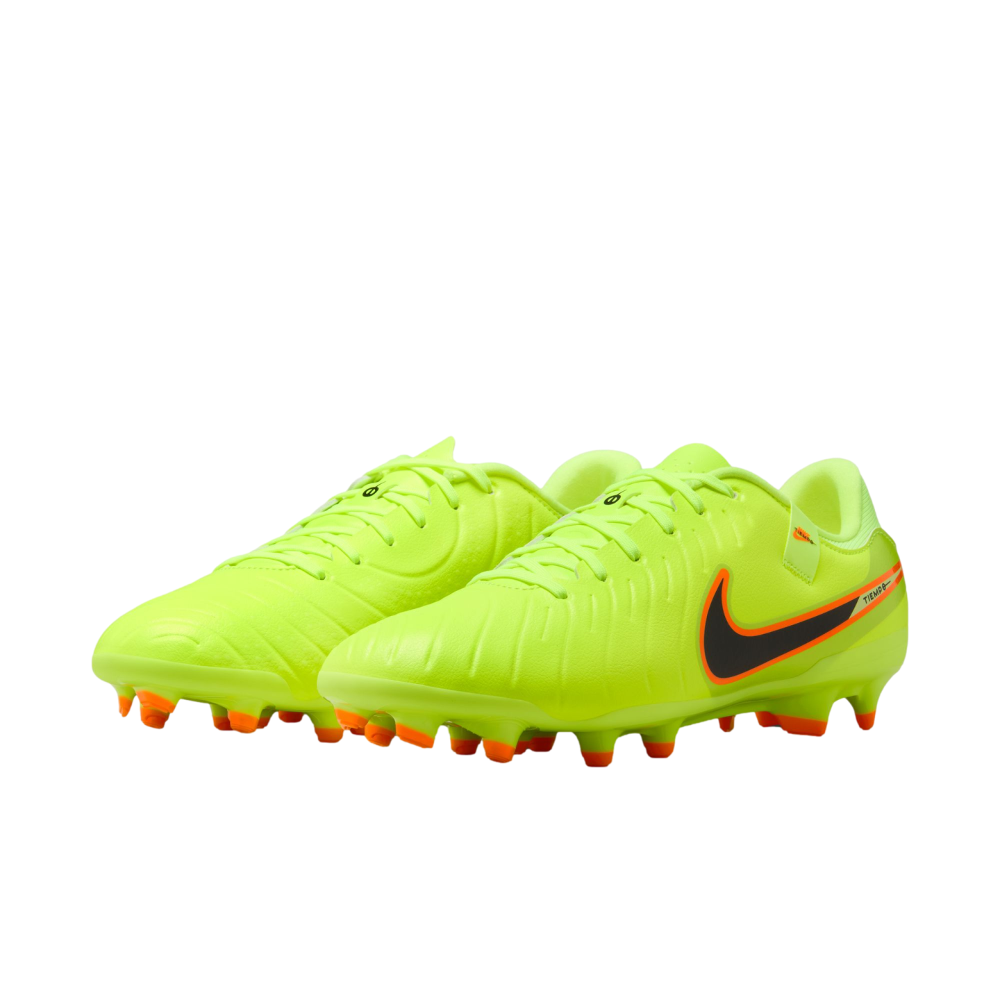 Neon yellow Nike Tiempo soccer cleats with a black swoosh and orange studs, against a black background.