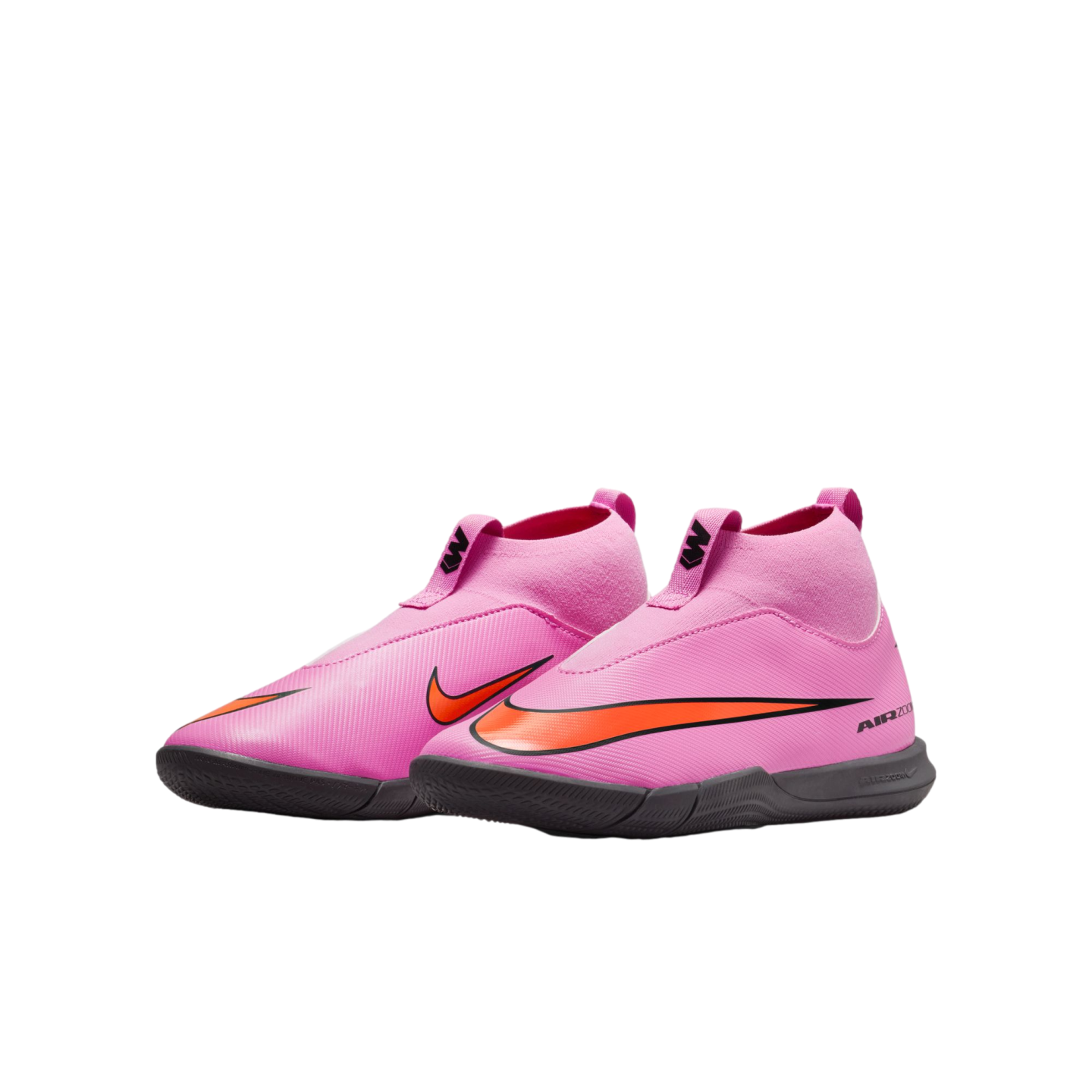 A pair of bright pink Nike Air Zoom Mercurial indoor soccer shoes with orange swooshes and black soles, isolated against a solid black background.