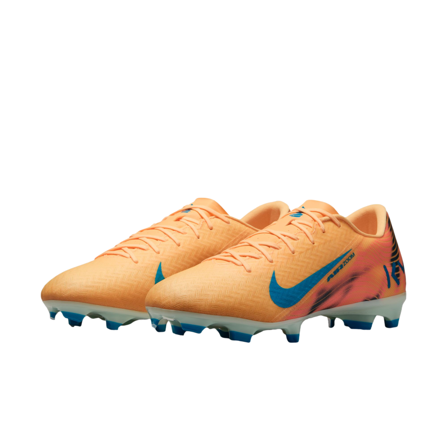 A pair of peach-colored Nike Air Zoom soccer cleats with a blue swoosh and blue studs, set against a solid black background.