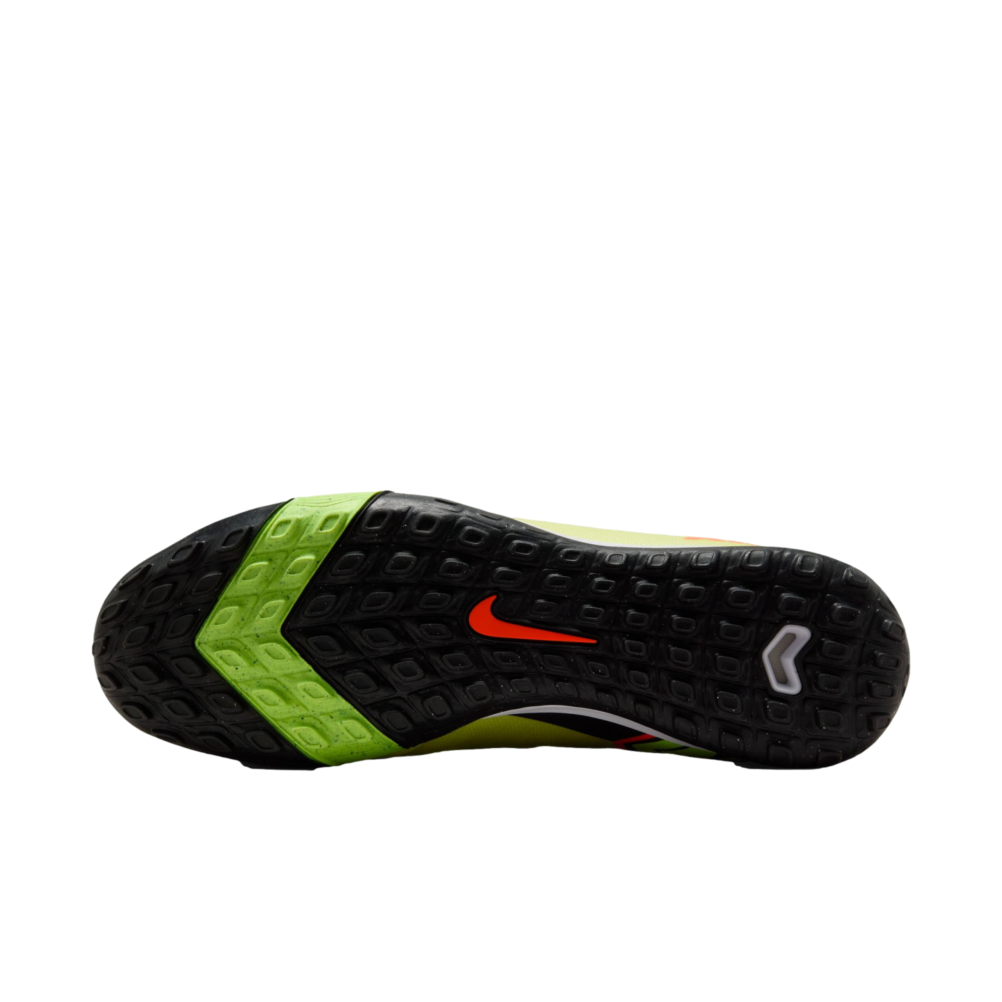 The textured sole of a black and neon green Nike turf soccer shoe with an orange swoosh, featuring small rubber studs for grip, shown against a black background.