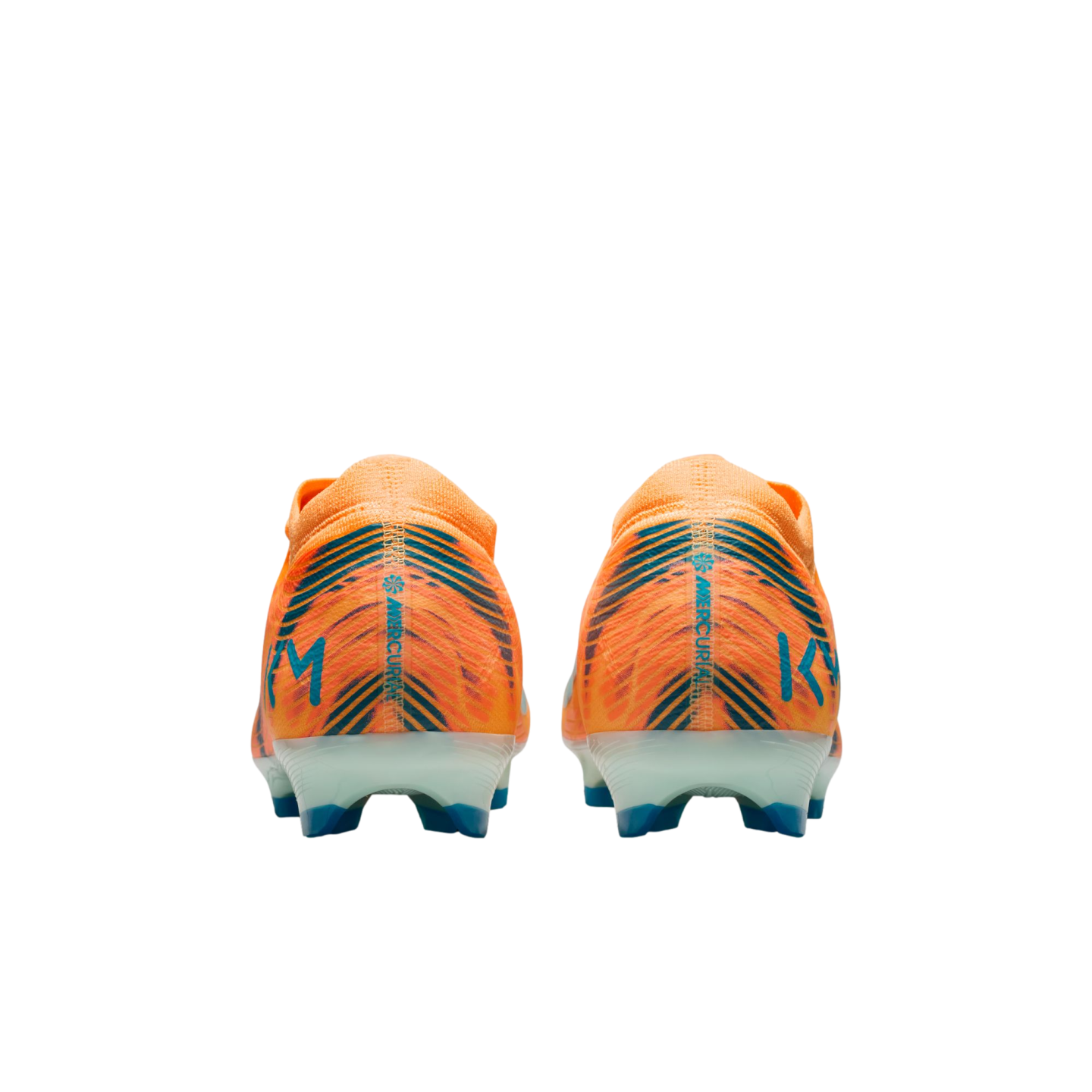 Rear view of two orange Nike Mercurial soccer cleats with blue details and "KM" branding, on a solid black background.