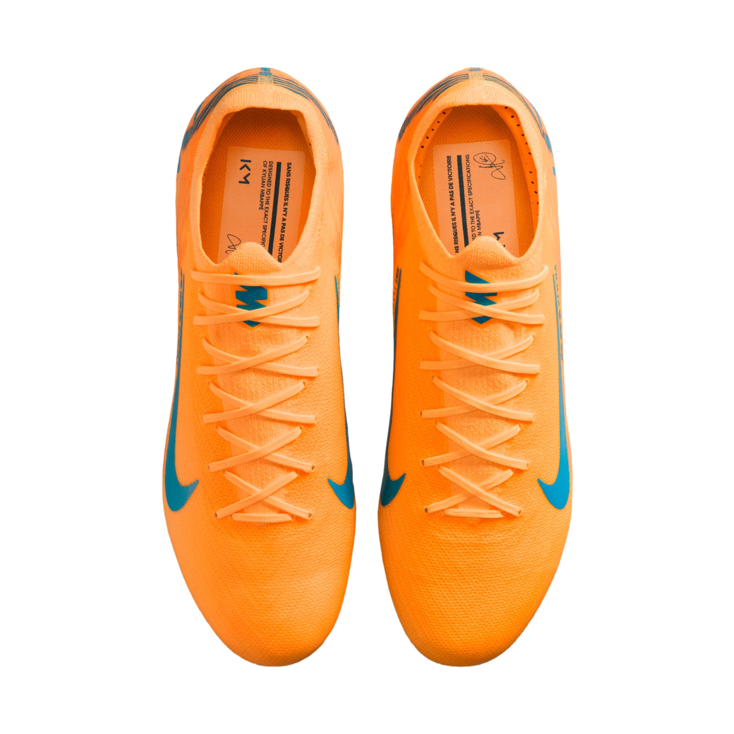 A top-down view of a pair of bright orange Nike soccer cleats with light blue accents and laces, isolated against a solid black background.