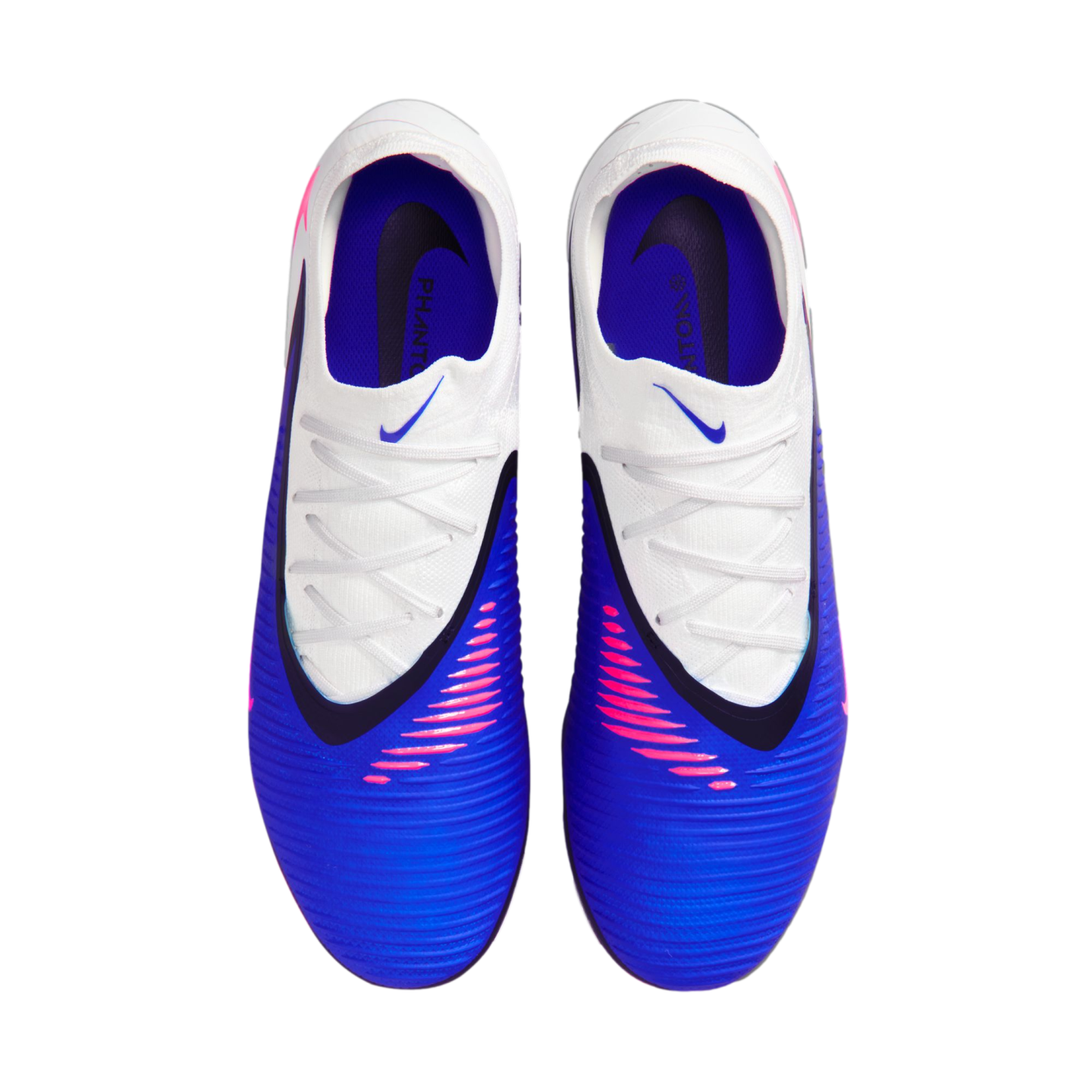 Top-down view of blue and white Nike Phantom soccer cleats with pink accents and white laces. The textured blue forefoot and purple interior are clearly visible.