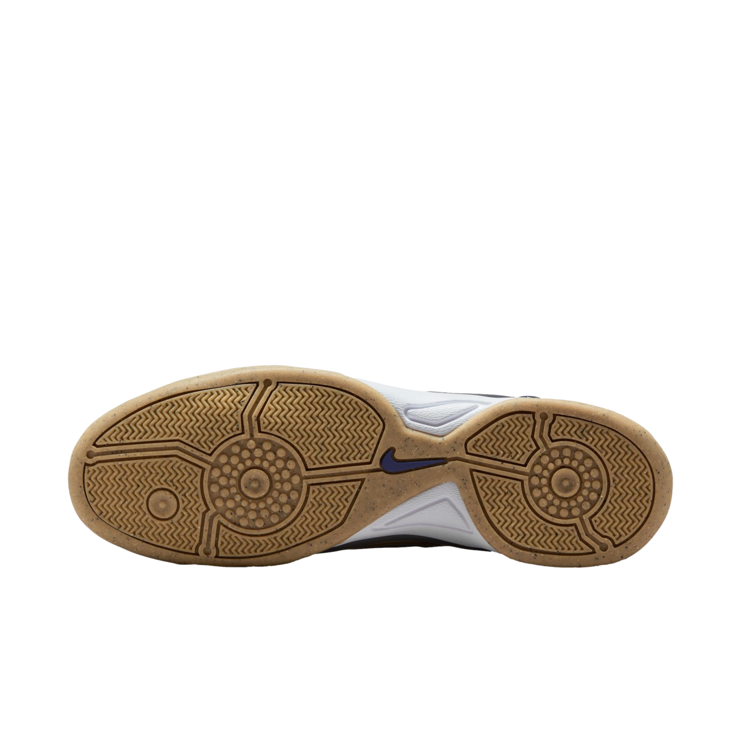 The gum rubber outsole of a Nike shoe, featuring intricate circular and zig-zag traction patterns with a small blue swoosh logo in the center arch.