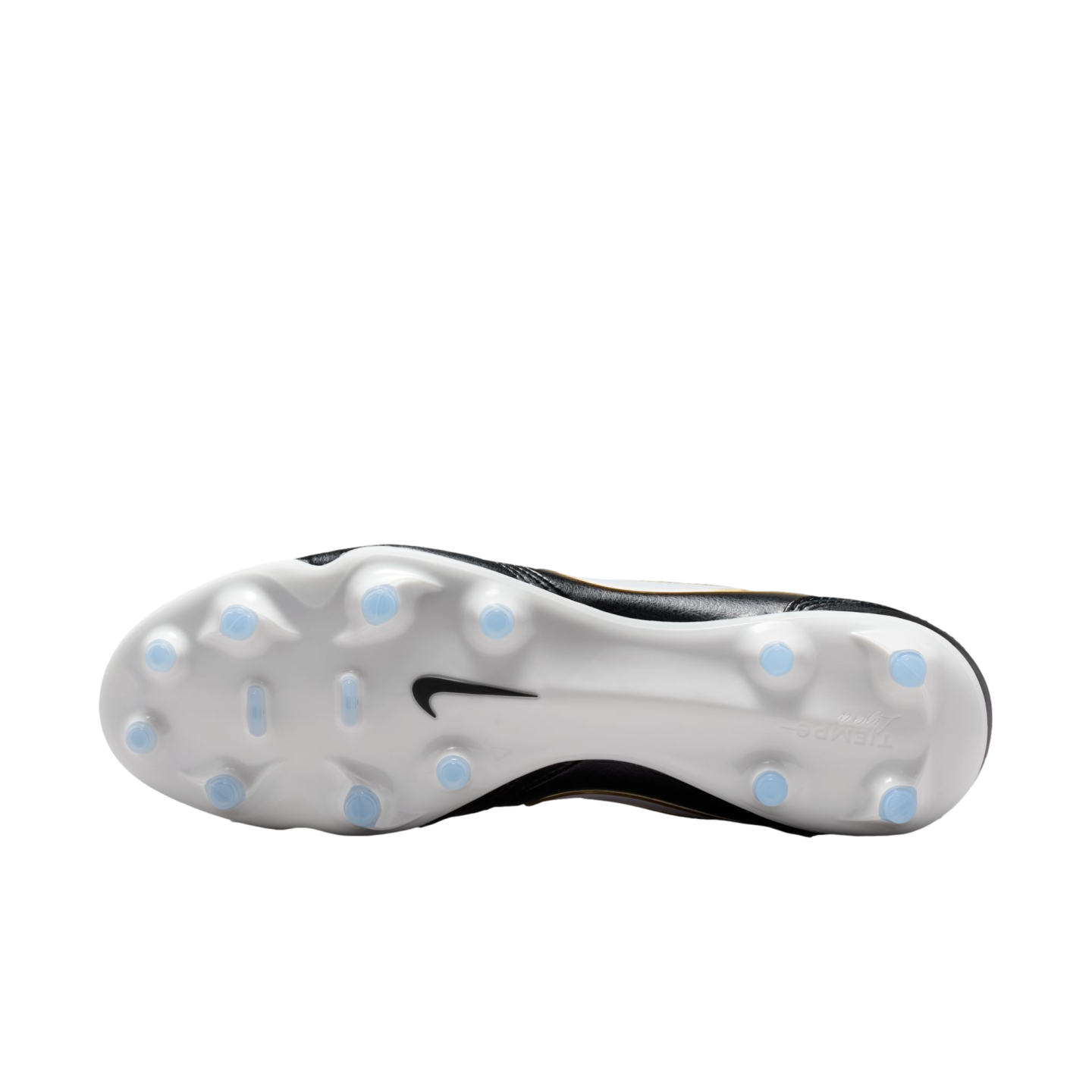 The white sole of a black Nike Tiempo soccer boot with light blue studs, shown against a black background.