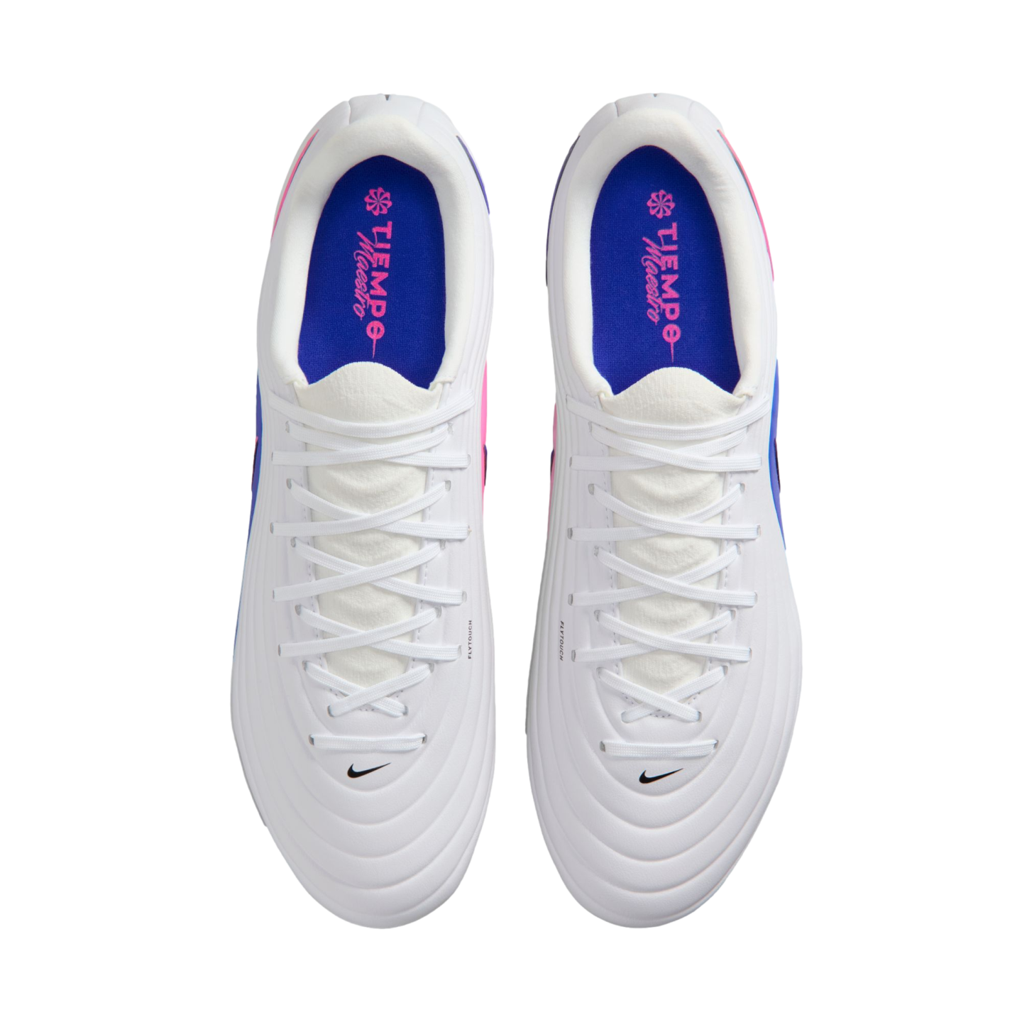 Top-down view of white Nike Tiempo Maestro soccer cleats with blue insoles, pink accents, and white laces against a black background.