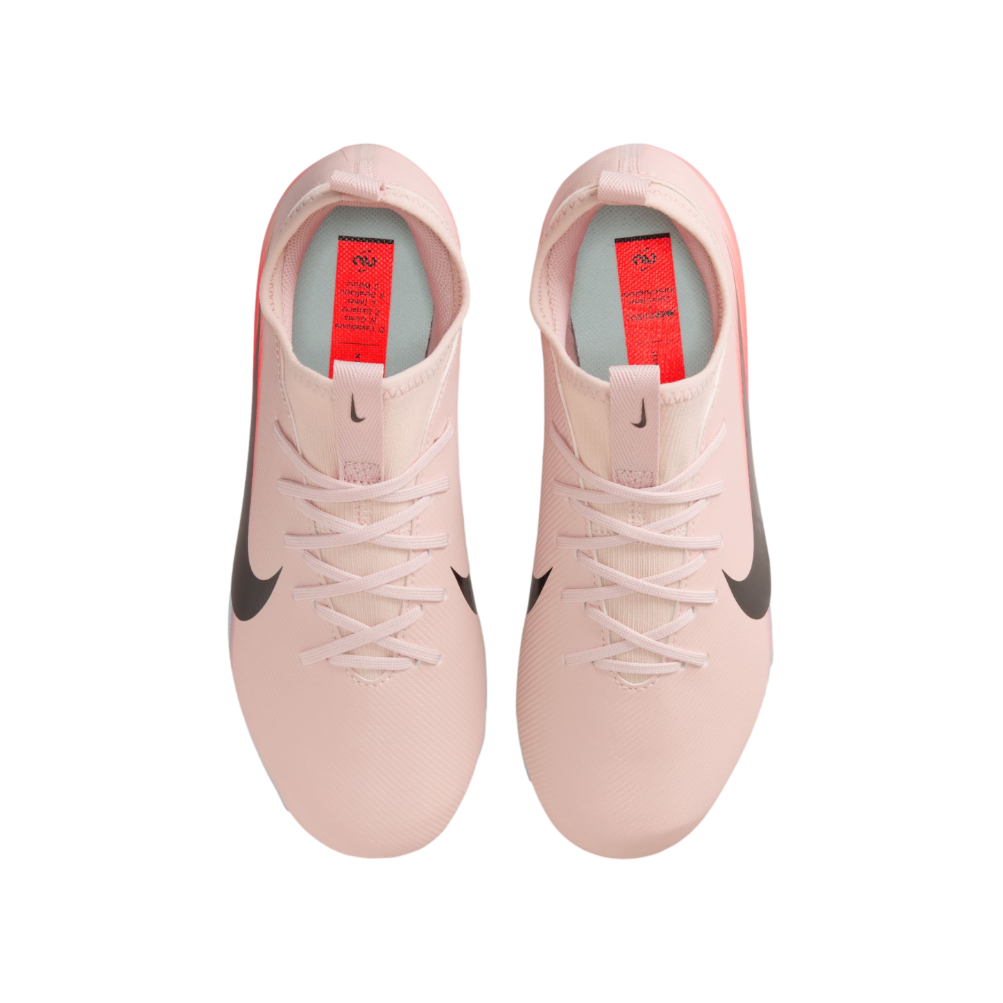 Top-down view of a pair of light pink Nike Mercurial soccer cleats with black swooshes, displayed on a black background.