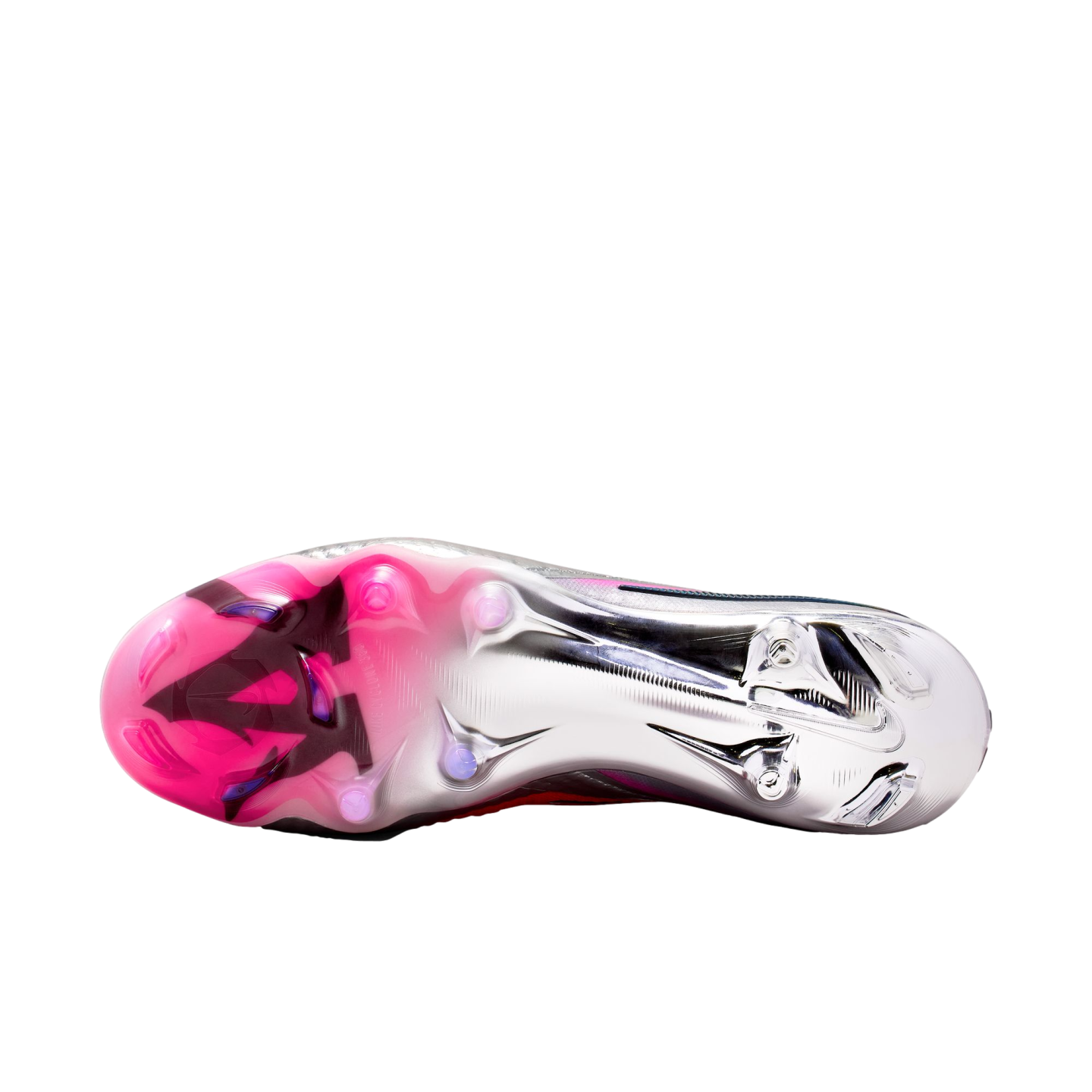 Underside of a Nike soccer cleat showing a metallic silver and pink soleplate with circular studs against a black background.