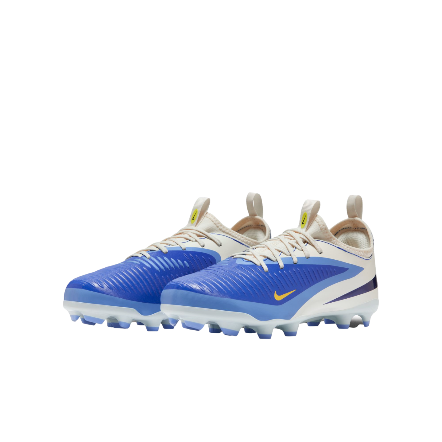 A pair of blue and cream Nike soccer cleats with yellow accents and a textured upper, shown against a solid black background.