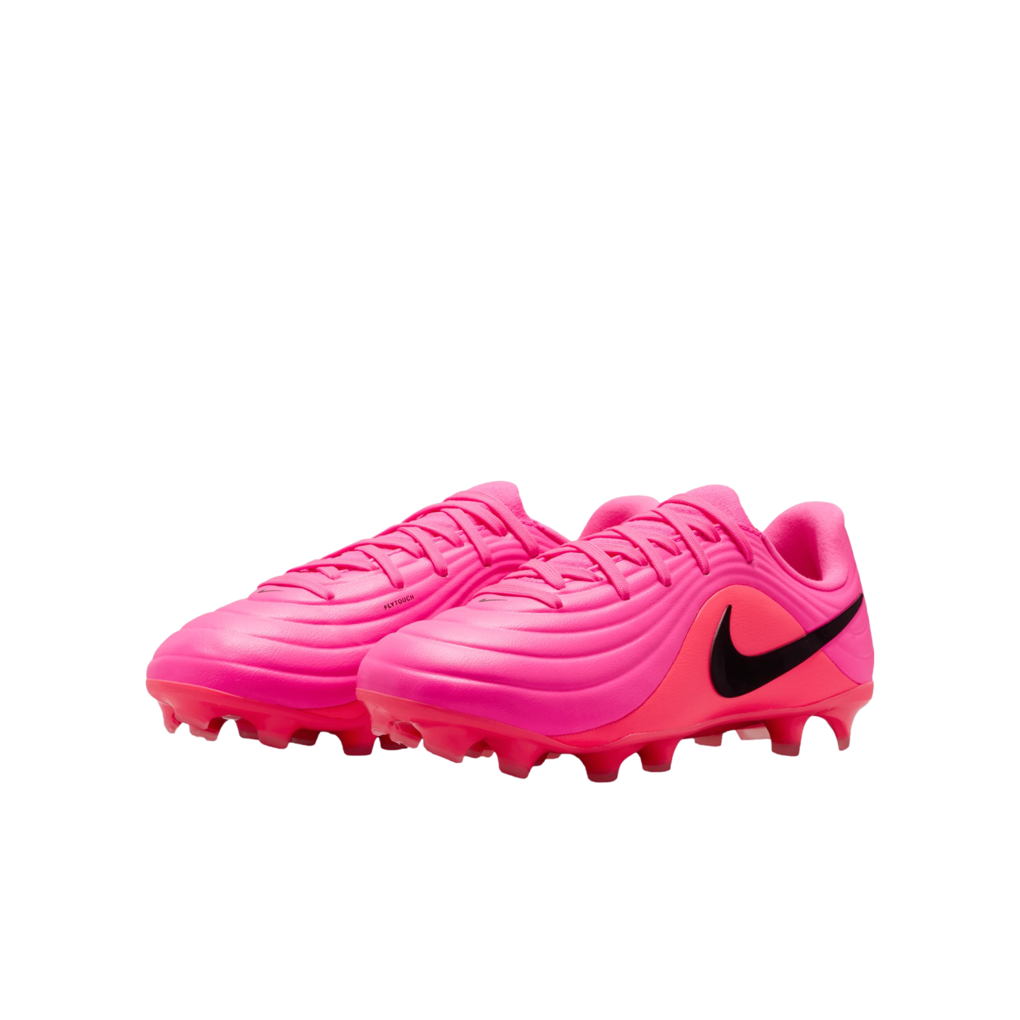 A pair of bright pink Nike soccer cleats with black swooshes and textured uppers on a white background.