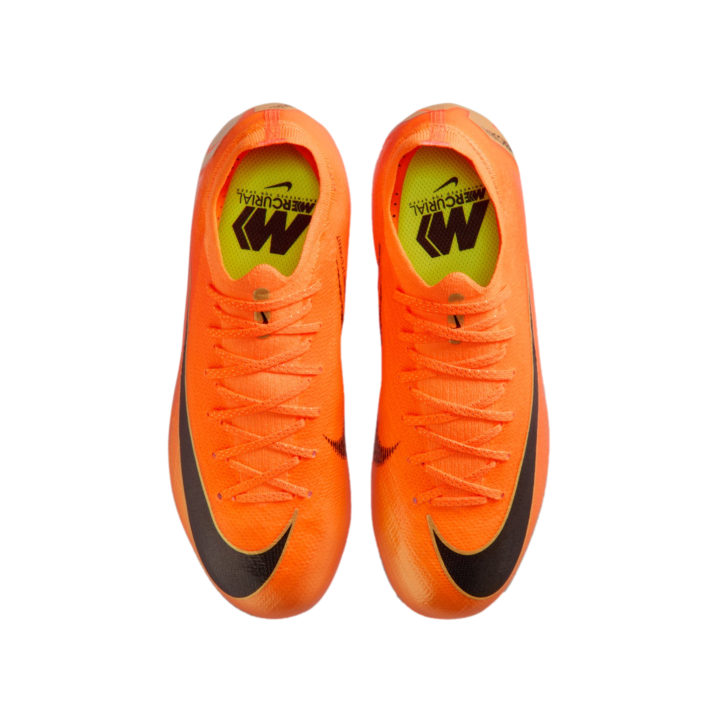 Top-down view of bright orange Nike Mercurial soccer cleats with yellow insoles and black swooshes on a black background.