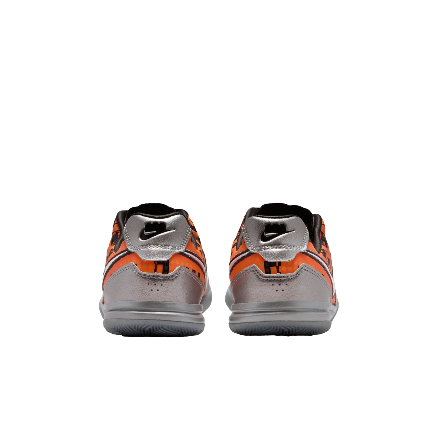 Rear view of a pair of orange and silver Nike athletic shoes with black accents on a white background.