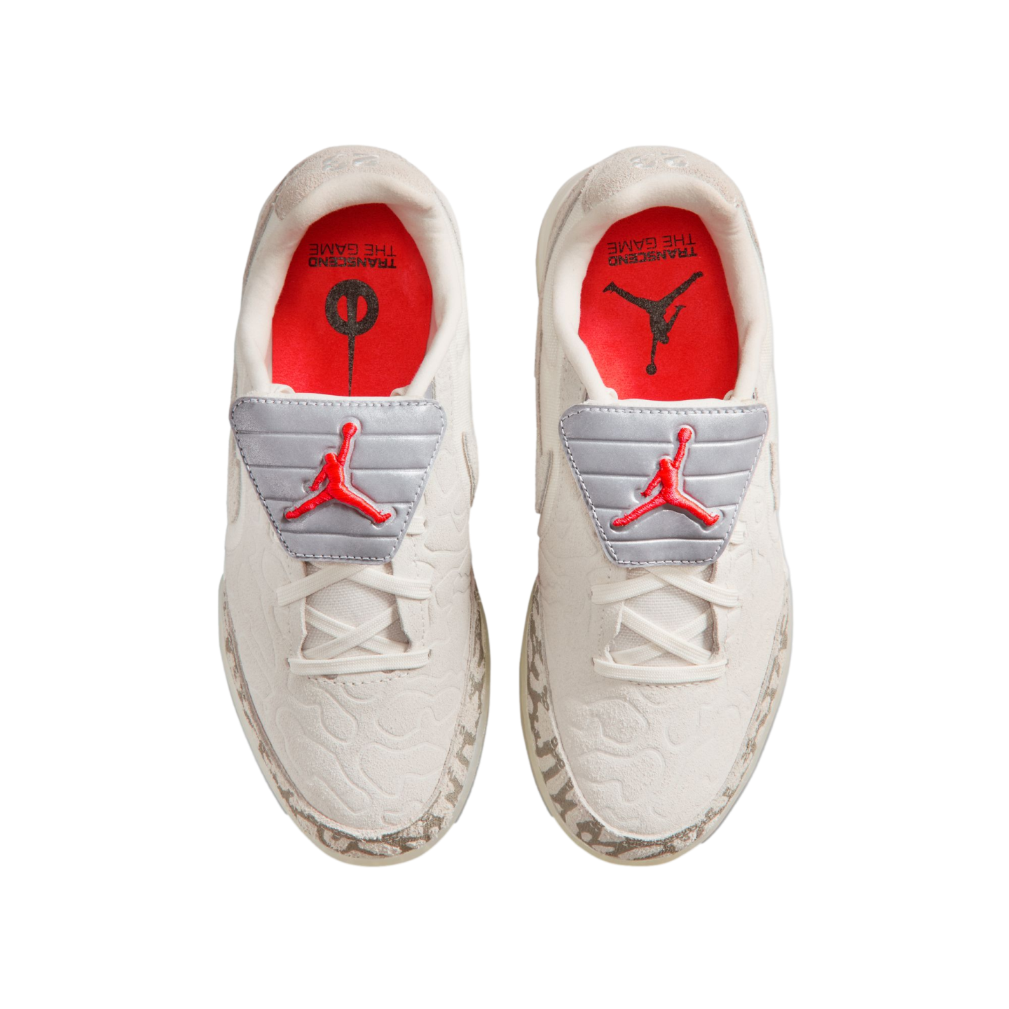 Top-down view of white low-top Air Jordan sneakers with red Jumpman logos on grey tongue flaps, red insoles, and light patterned trim, presented on a black background.