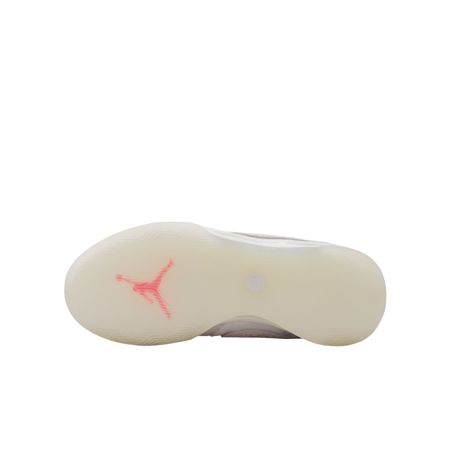 An underside view of a white basketball shoe featuring a translucent sole with a pink Jumpman logo, set against a solid black background.