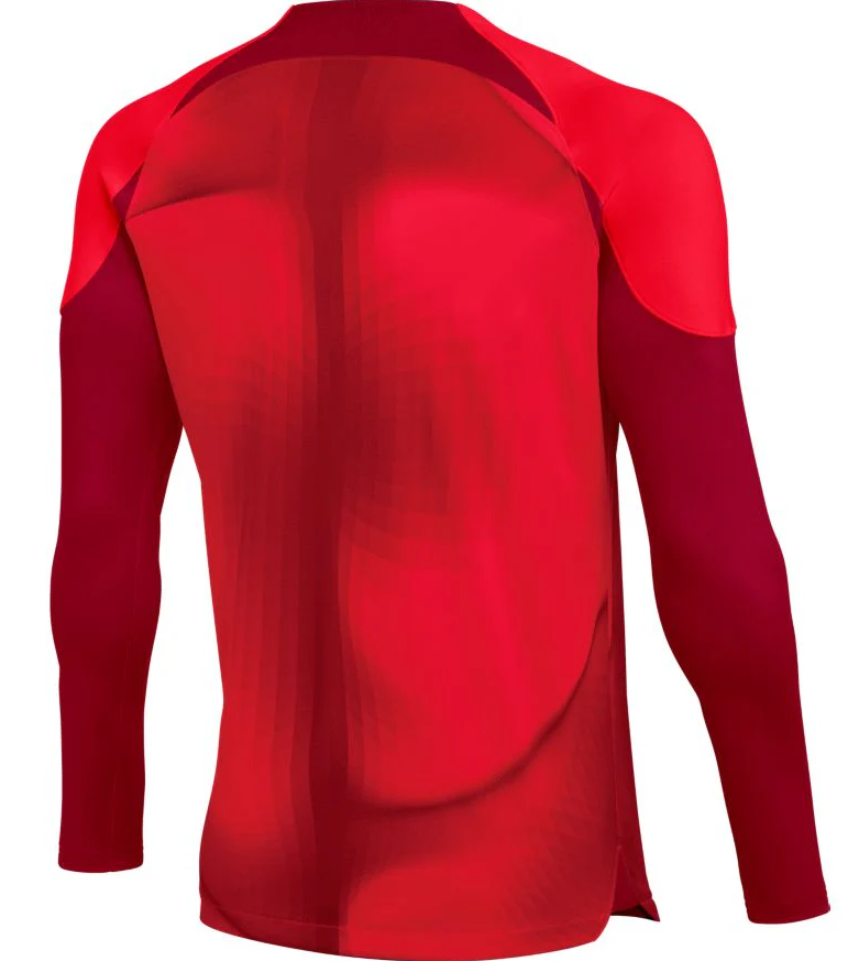 The back view of a long-sleeved athletic jersey featuring two shades of red. The design has dark maroon sleeves and shoulder accents, with a bright crimson main panel showing a subtle, flowing geometric pattern.