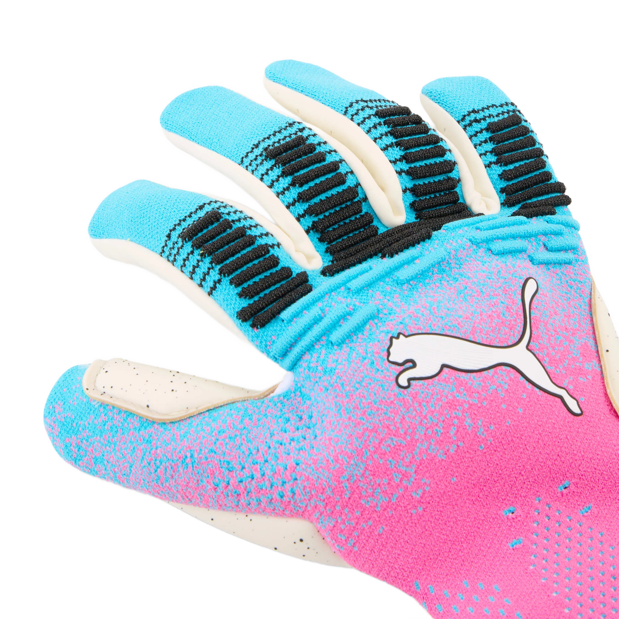 A close-up shot of a Puma goalkeeper glove featuring a vibrant pink and blue gradient design with black textured grip accents on the fingers and a white Puma logo.