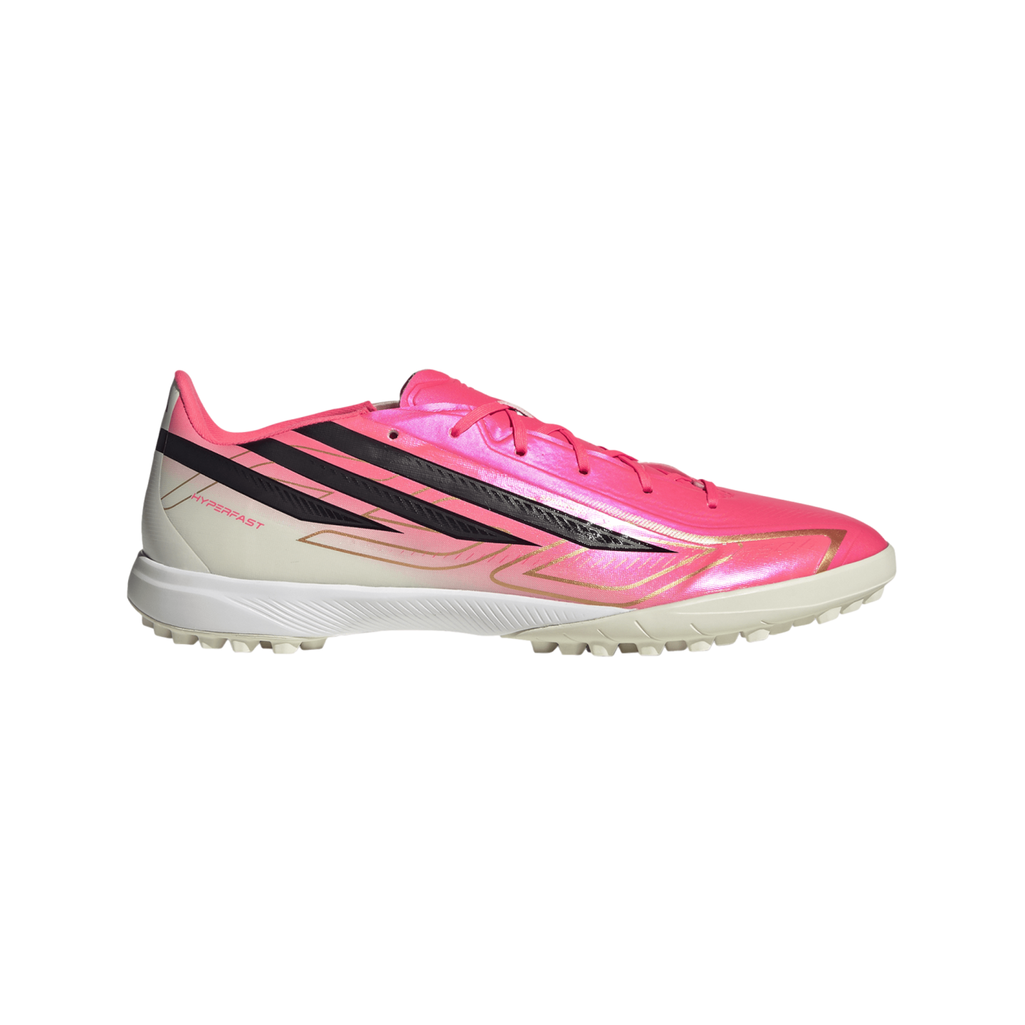 Vibrant pink and white athletic turf shoe with three bold black diagonal stripes, gold detailing, and "HYPERFAST" text on the side.
