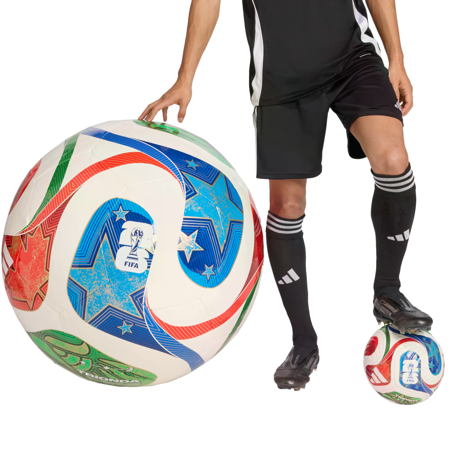 Person in black soccer gear with one hand on a giant ball and one foot on a regular one. Both balls feature vibrant star patterns and a FIFA logo, set against a black background.