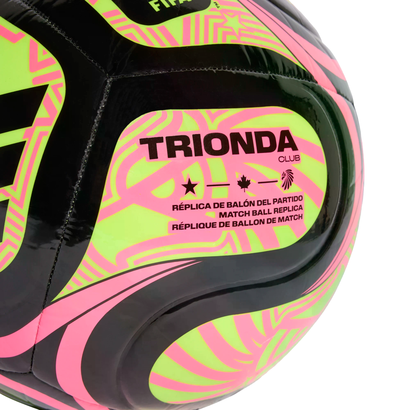Close-up of a black, neon yellow, and pink TRIONDA CLUB soccer ball. The label "MATCH BALL REPLICA" is printed below star, maple leaf, and bird icons.