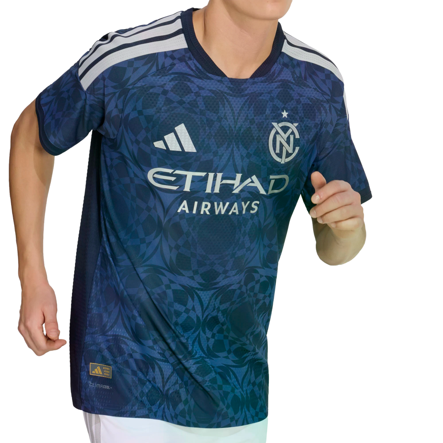 A person wearing a blue NYCFC soccer jersey with a geometric pattern, white shoulder stripes, and the Etihad Airways sponsor logo.