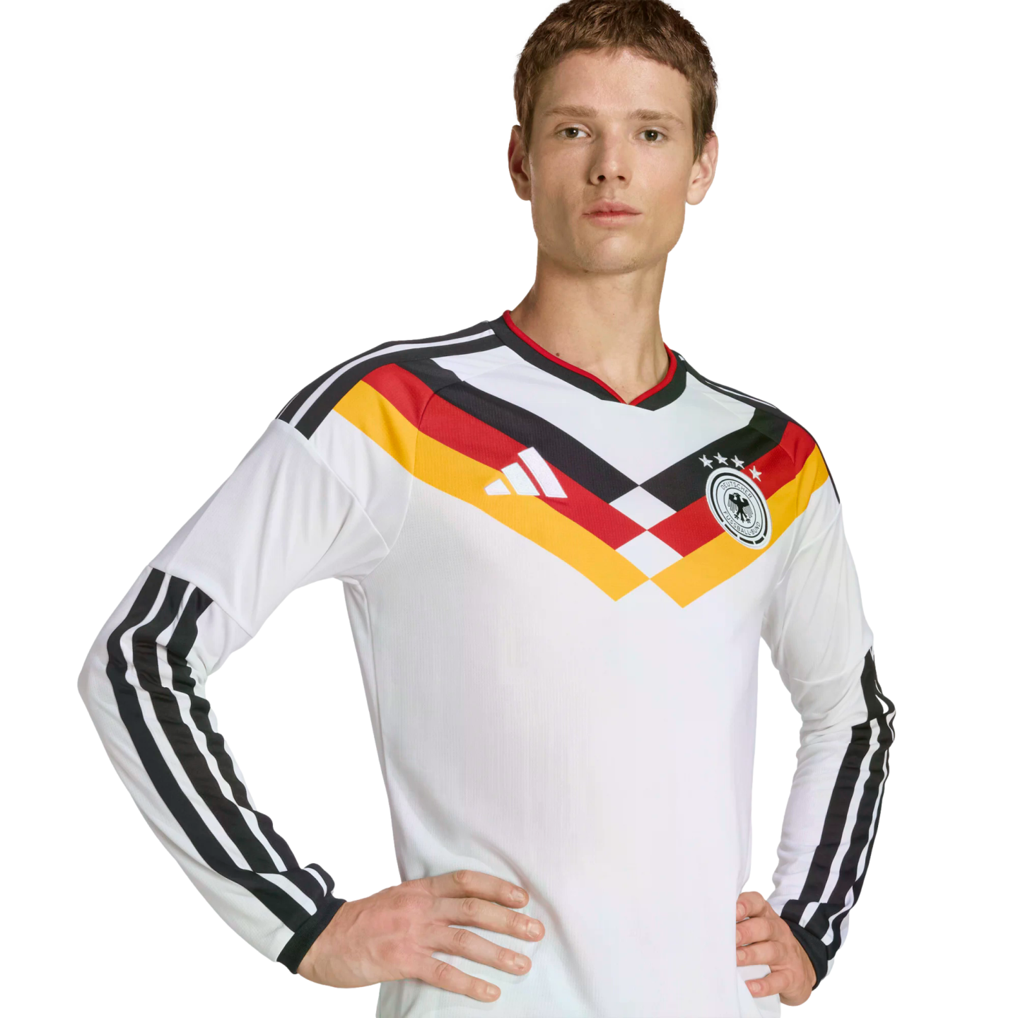 A man in a long-sleeved white German national team football jersey with black, red, and gold stripes across the chest, posing against a black background.