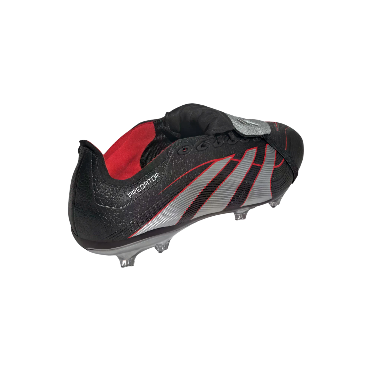 A black Adidas Predator soccer cleat with silver stripes and red accents, featuring a fold-over tongue and textured upper, against a solid black background.