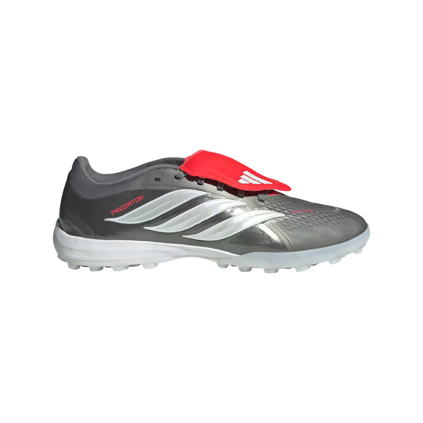 Side profile of a grey Adidas Predator turf shoe with white stripes and a red shroud over the laces, set against a solid black background.