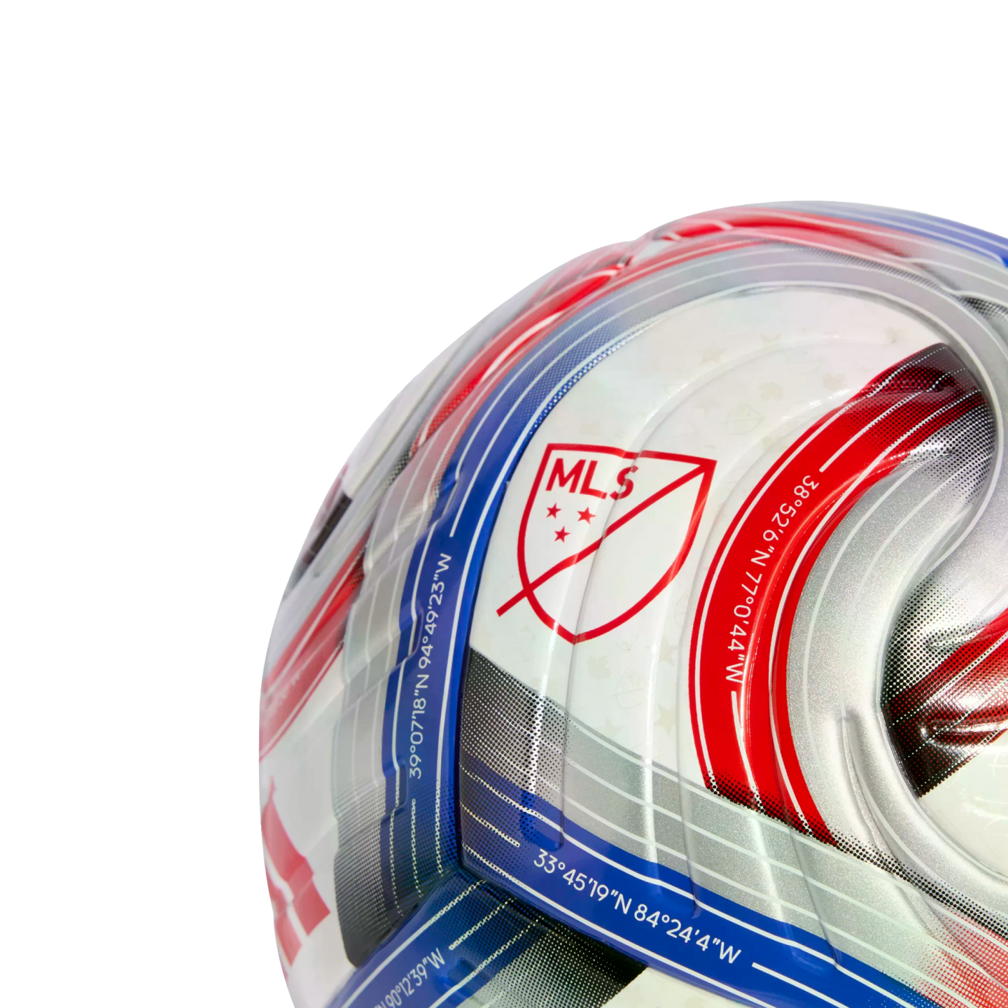 Close-up of an official MLS soccer ball featuring the league crest, red and blue stripes, and geographical coordinates printed along the patterned panels.