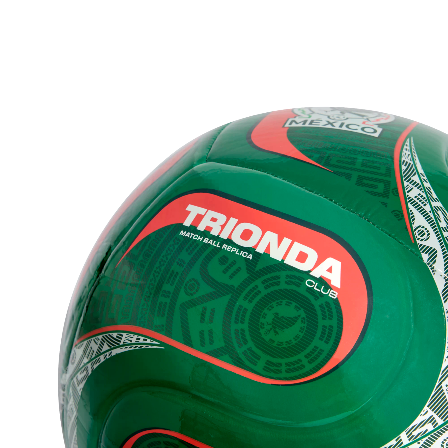 Close-up of a green soccer ball with Mexico-themed Aztec patterns and a red-bordered section labeled "TRIONDA CLUB MATCH BALL REPLICA".
