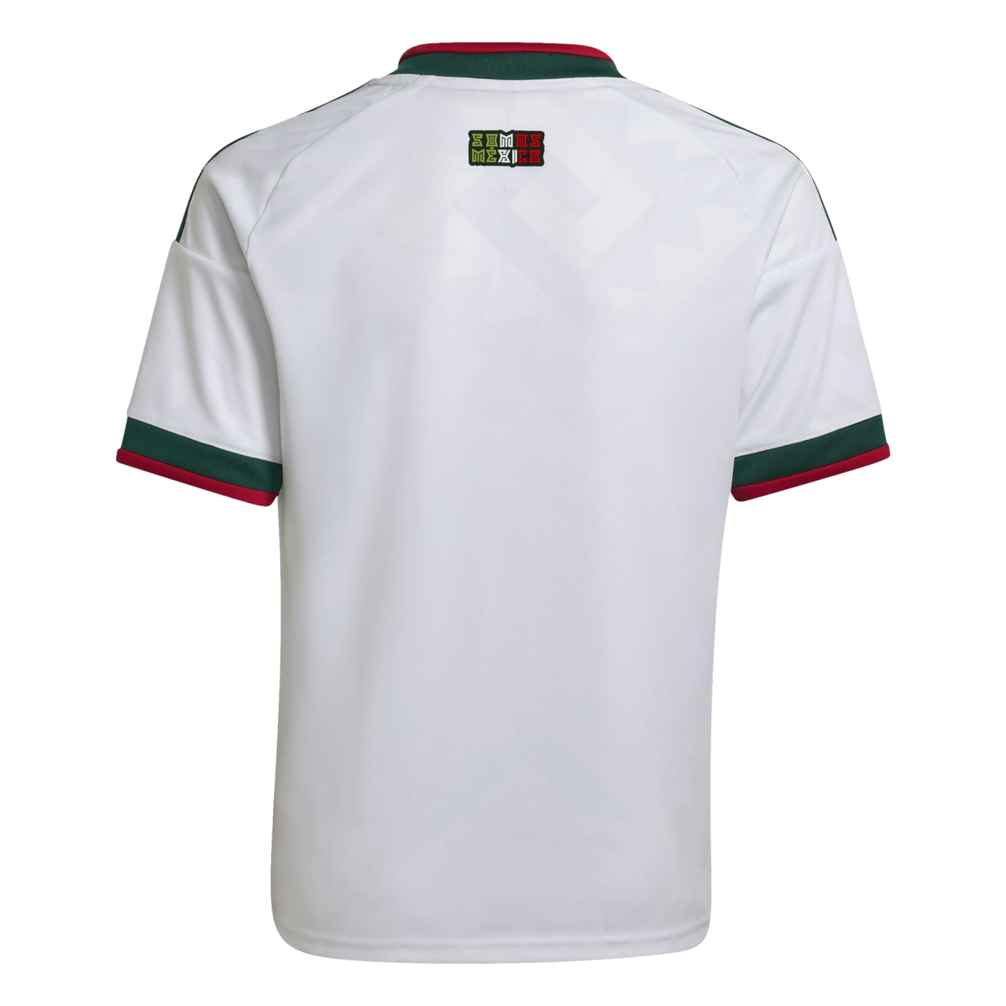 Back view of a white soccer jersey with green and red accents on the collar and cuffs. A small "Somos México" logo is centered on the upper back.