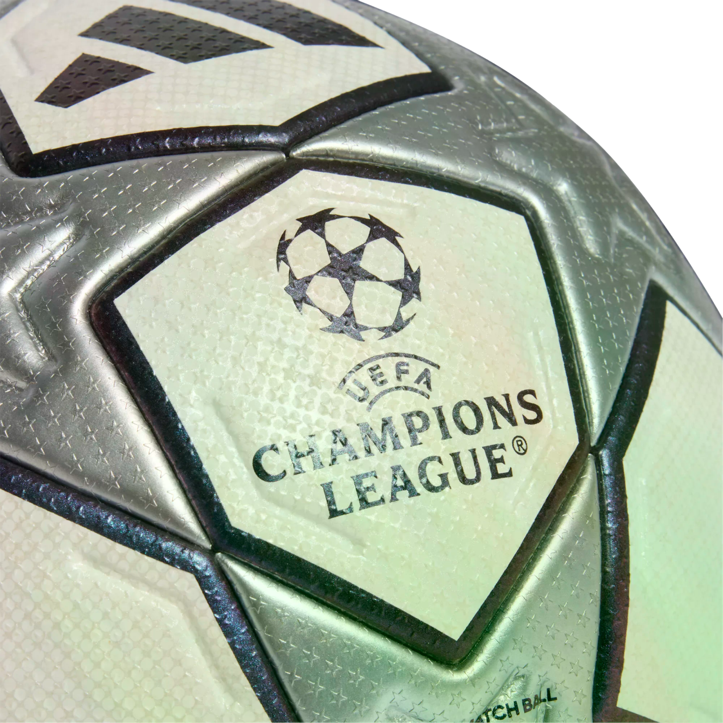 Close-up of a silver and white Adidas UEFA Champions League soccer ball, showcasing the official logo and textured star pattern.