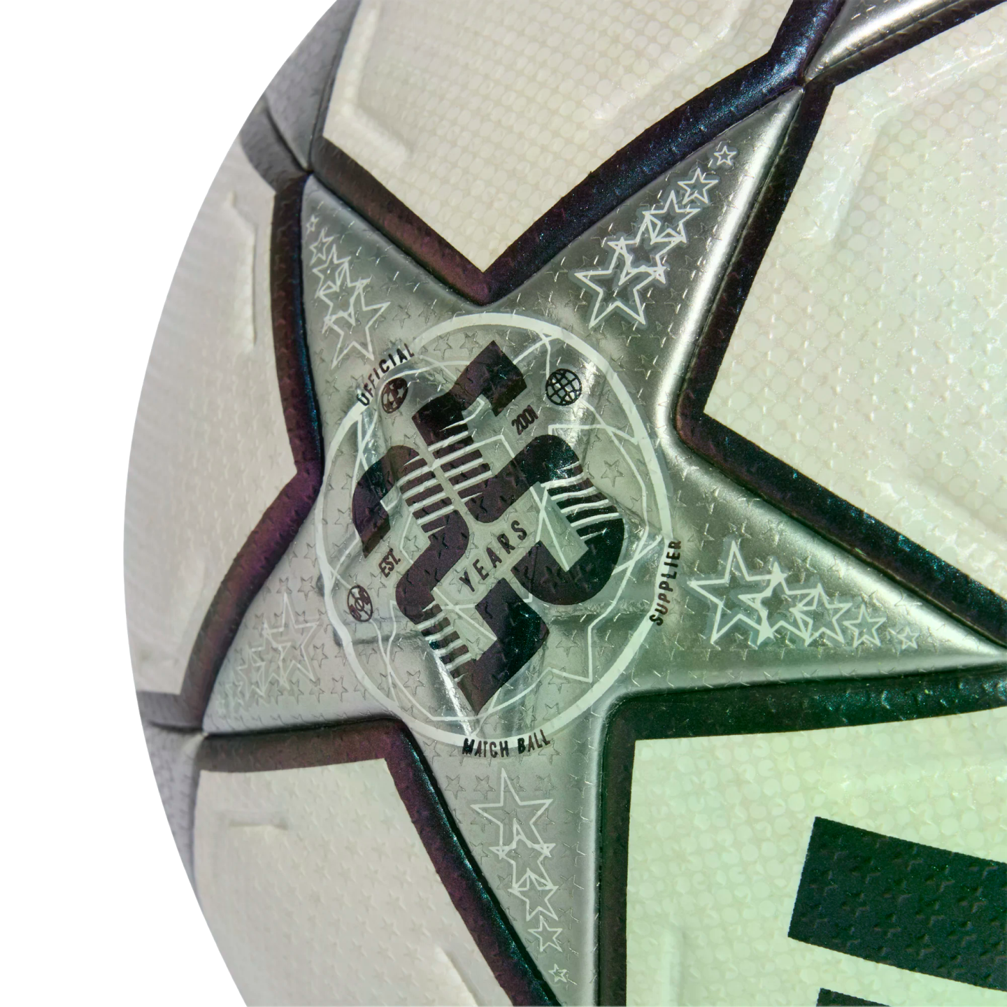 Close-up of a white and silver textured soccer ball with a star panel featuring a 20th-anniversary "Official Match Ball Supplier" logo.