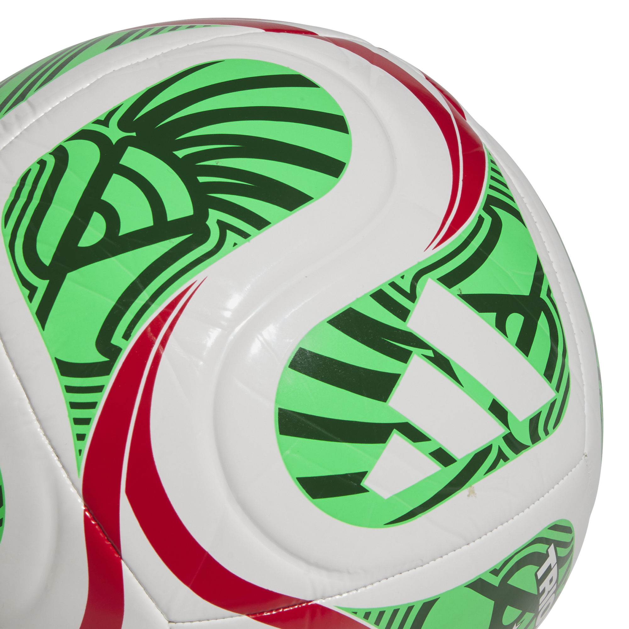 Close-up of a white Adidas soccer ball featuring vibrant green and red graphic patterns, set against a solid black background.