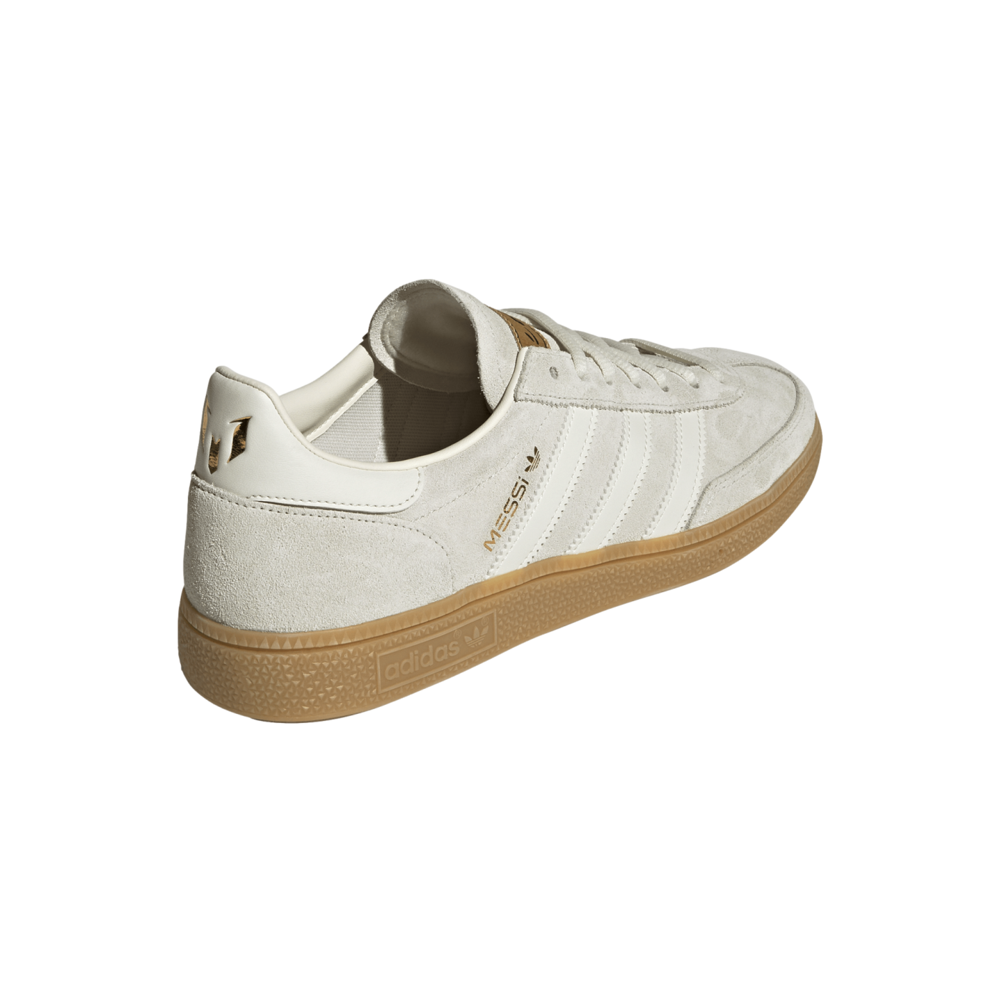 Rear-quarter view of an off-white Adidas Samba shoe with gold Messi branding and a gum rubber sole.
